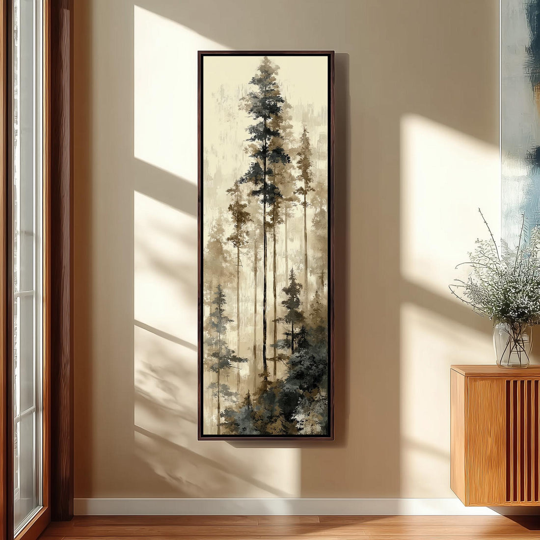 a large painting of a forest scene hanging on a wall, with a wooden chair and a small table in the foreground.