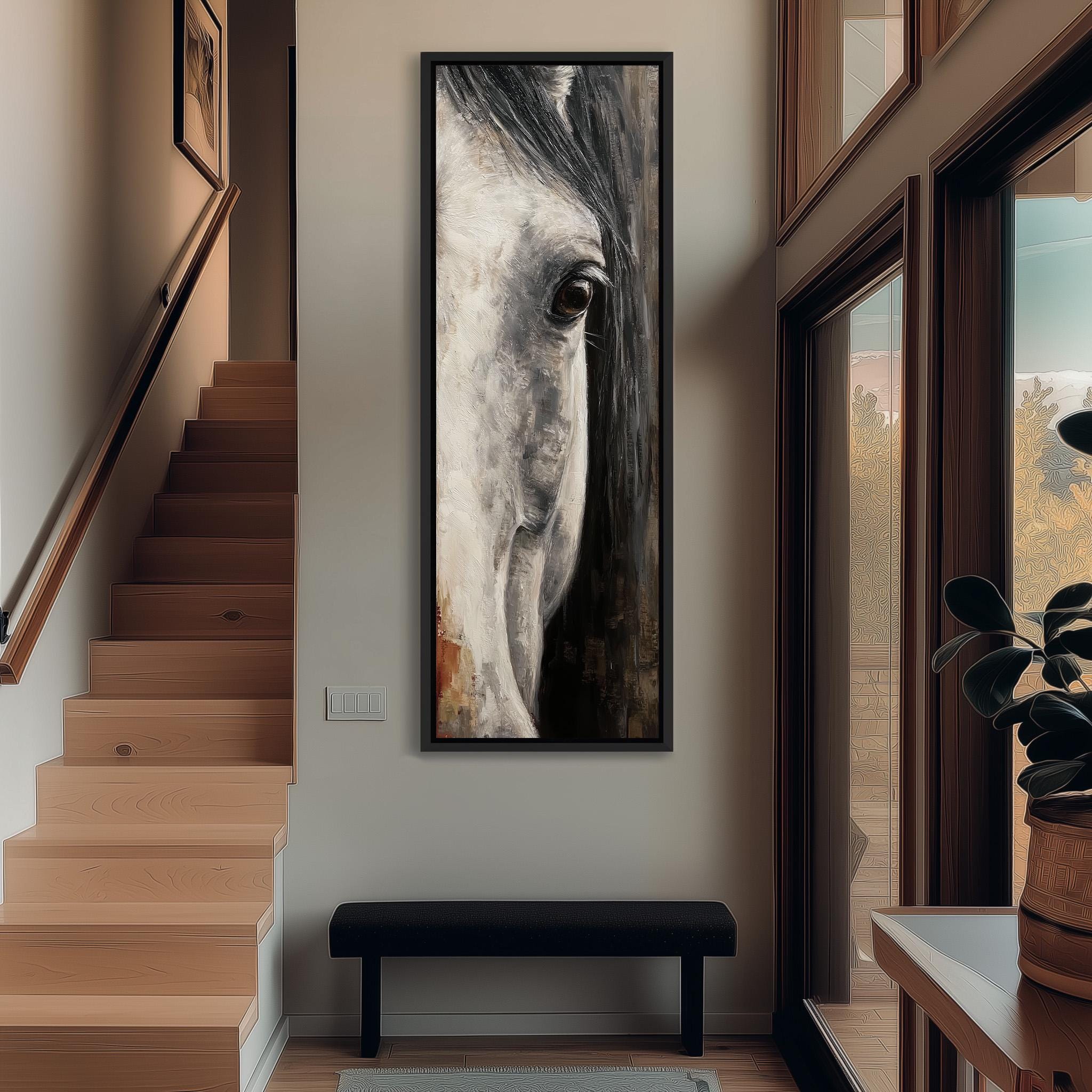 a large, framed painting of a horse's face hanging on the wall of a hallway.