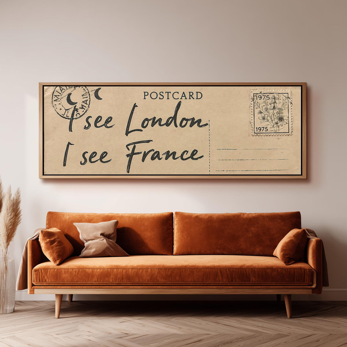 Postcard saying I see London, I see France panoramic canvas print above a sofa in a living room