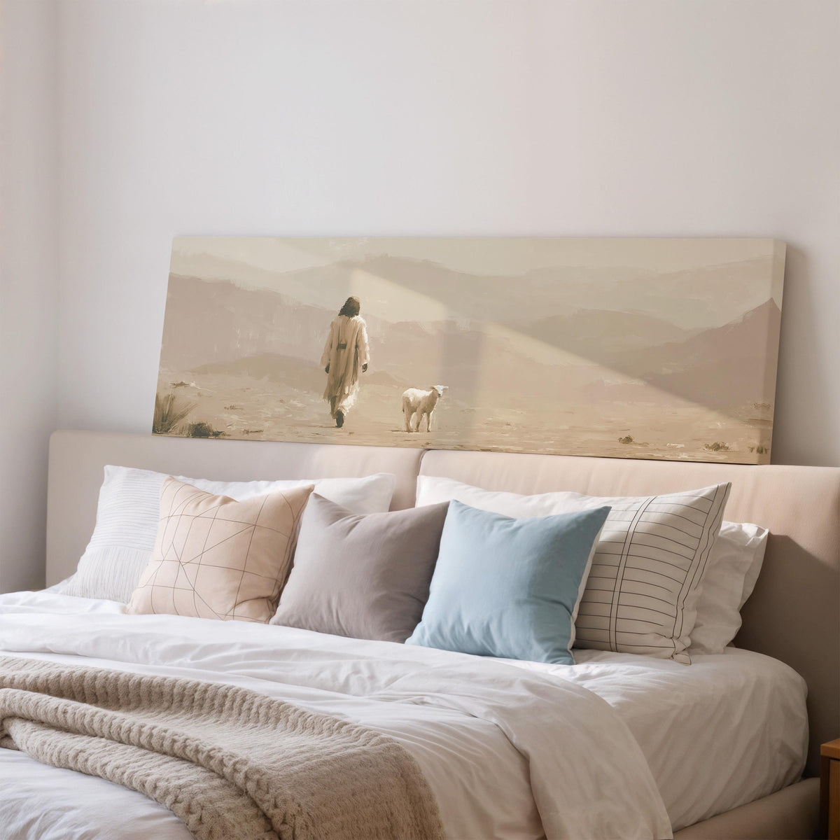Jesus walking with a lamb through the desert wide panoramic canvas print above a bed in a bedroom