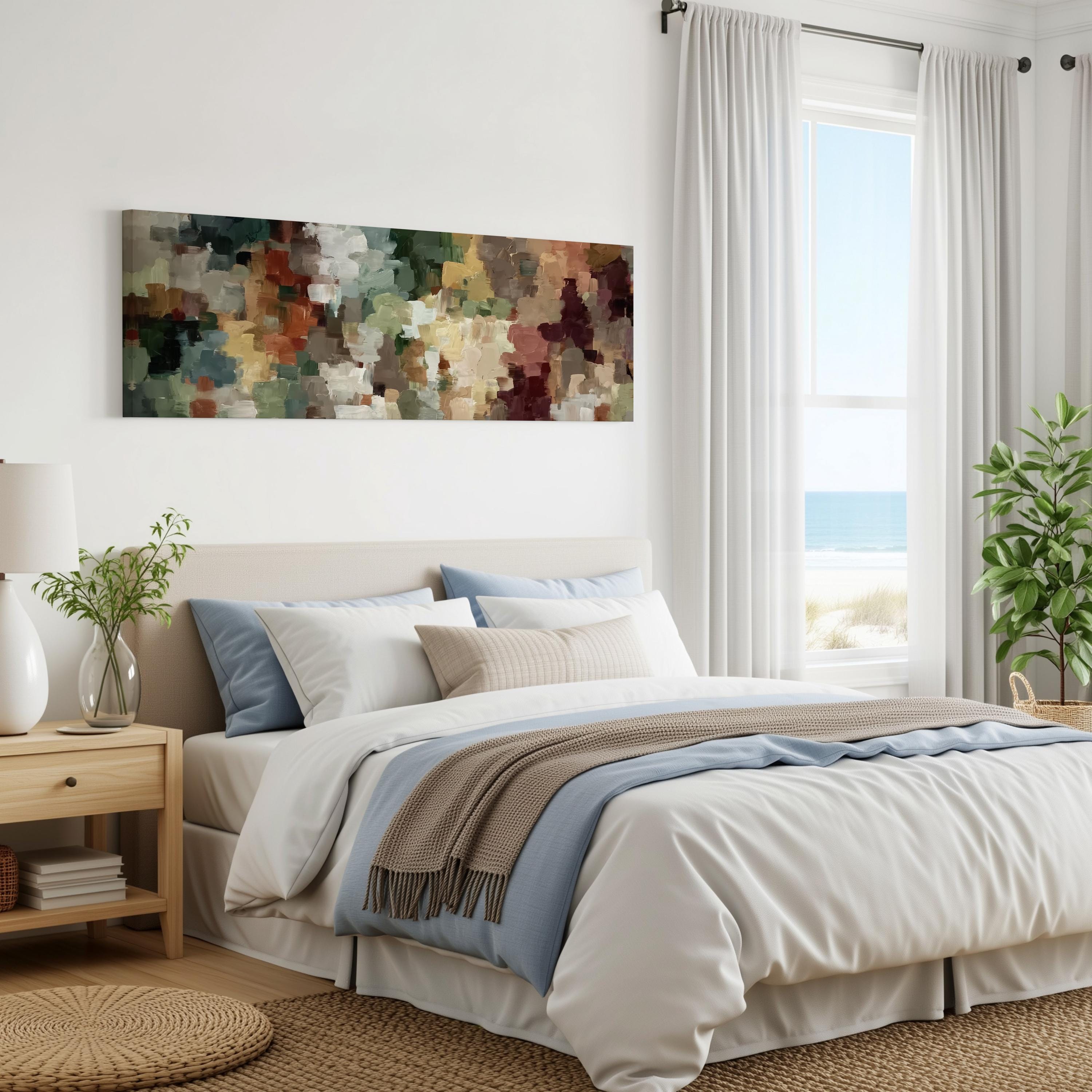 a serene and well-decorated bedroom with a large bed, a painting on the wall, and a window overlooking the ocean.
