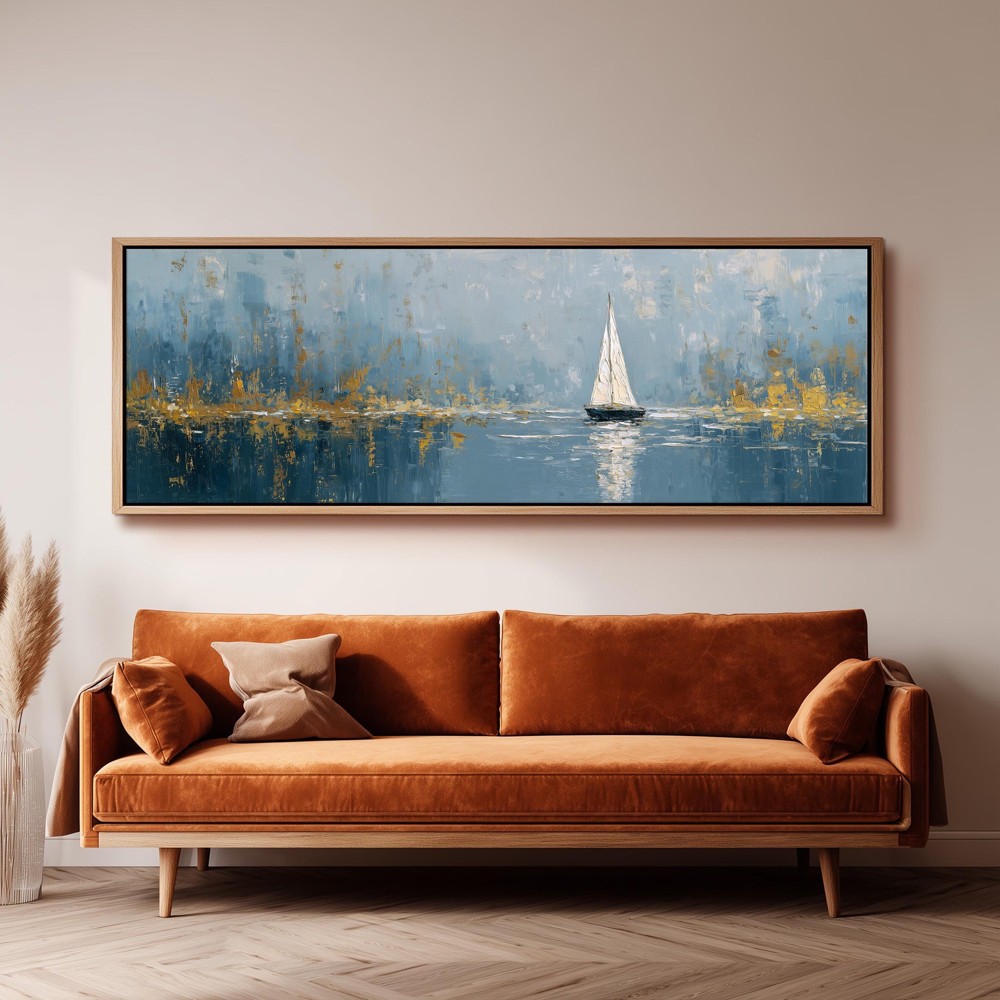 a large painting of a sailboat on a body of water, hanging on a wall above a brown sofa.