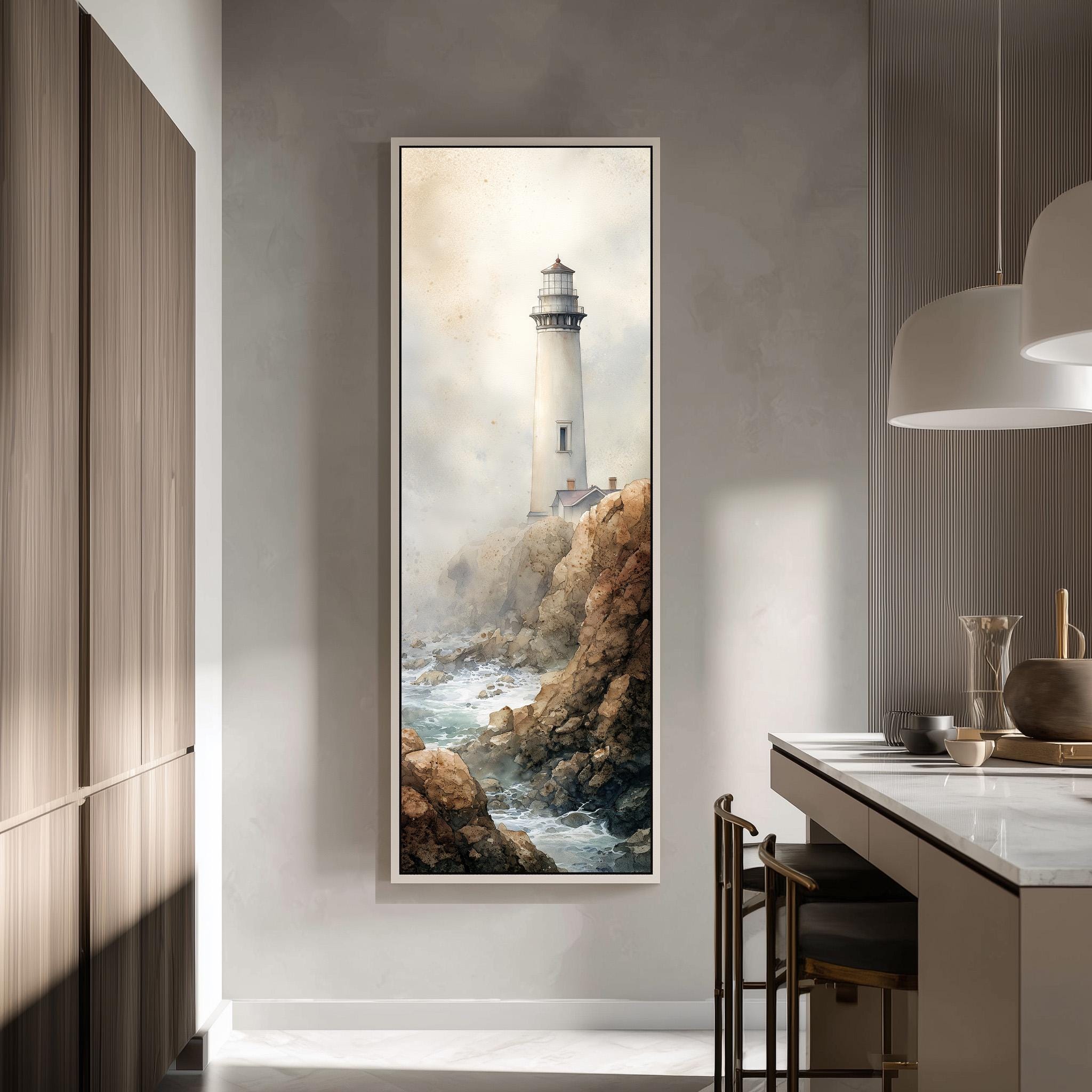 a large framed painting of a lighthouse on a rocky cliff, hanging on a wall in a modern kitchen.