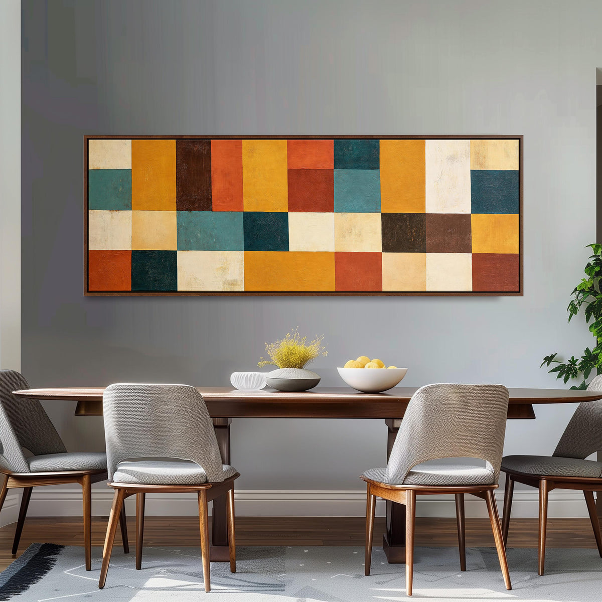 Ochre, rust and teal patchwork blocks long horizontal canvas print above a dining table