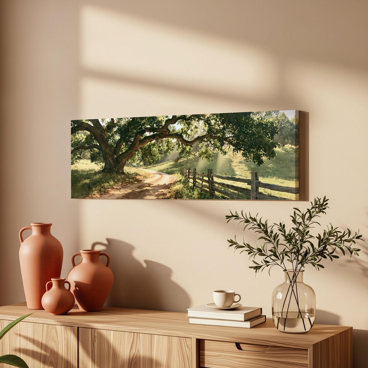 Sunlit country lane with oak trees and a wooden fence long horizontal canvas print above a wooden sideboard