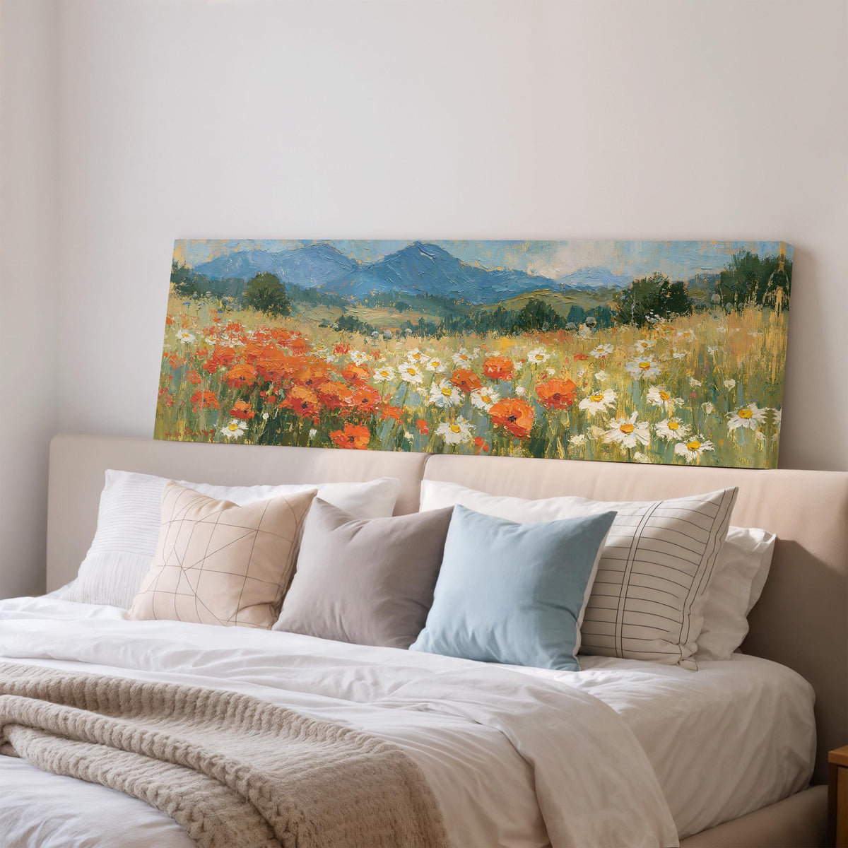 Alpine poppy and daisy meadow wide panoramic canvas print above a bed in a bedroom