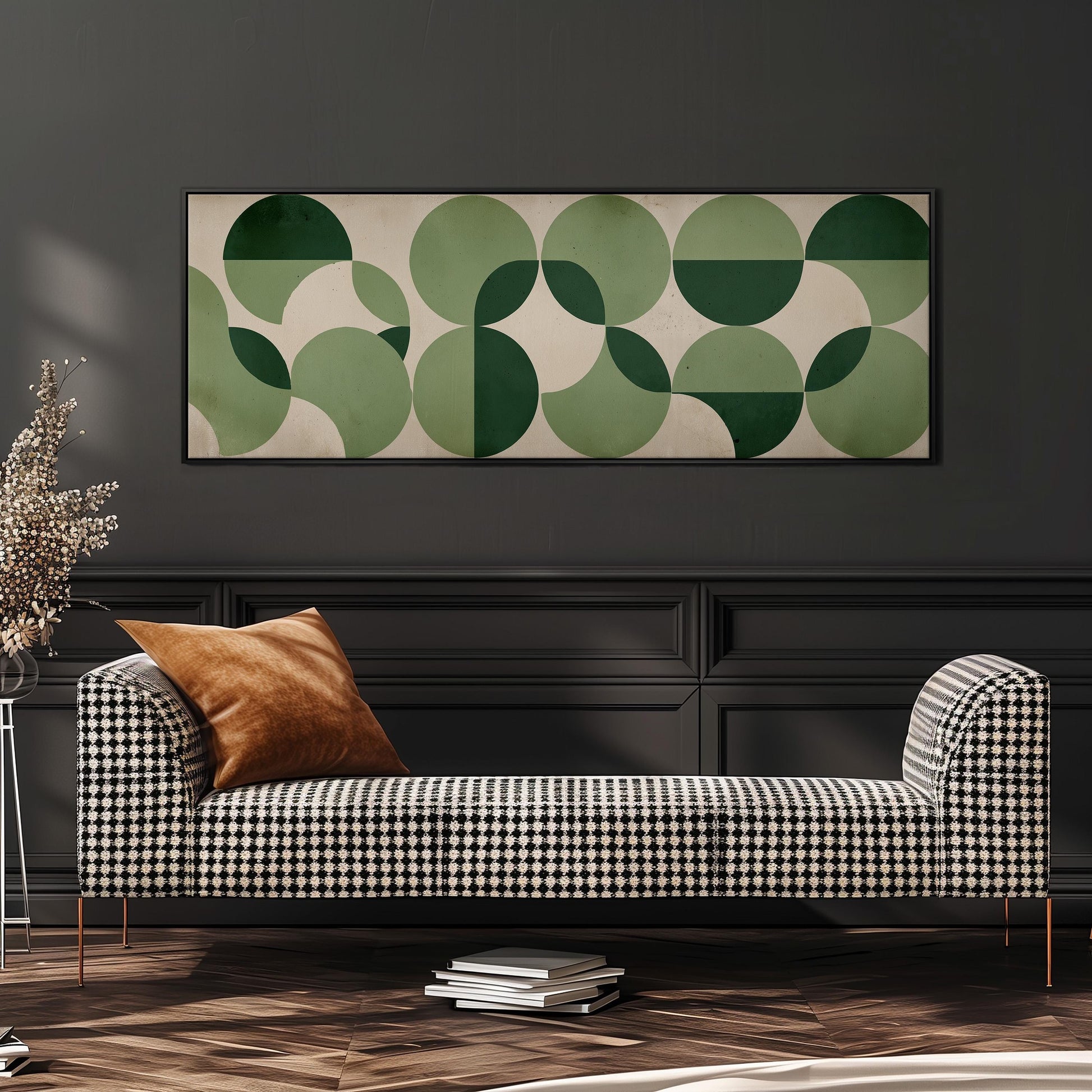 a modern living room with a black and white checkered sofa, a stack of books, and a large abstract painting on the wall.