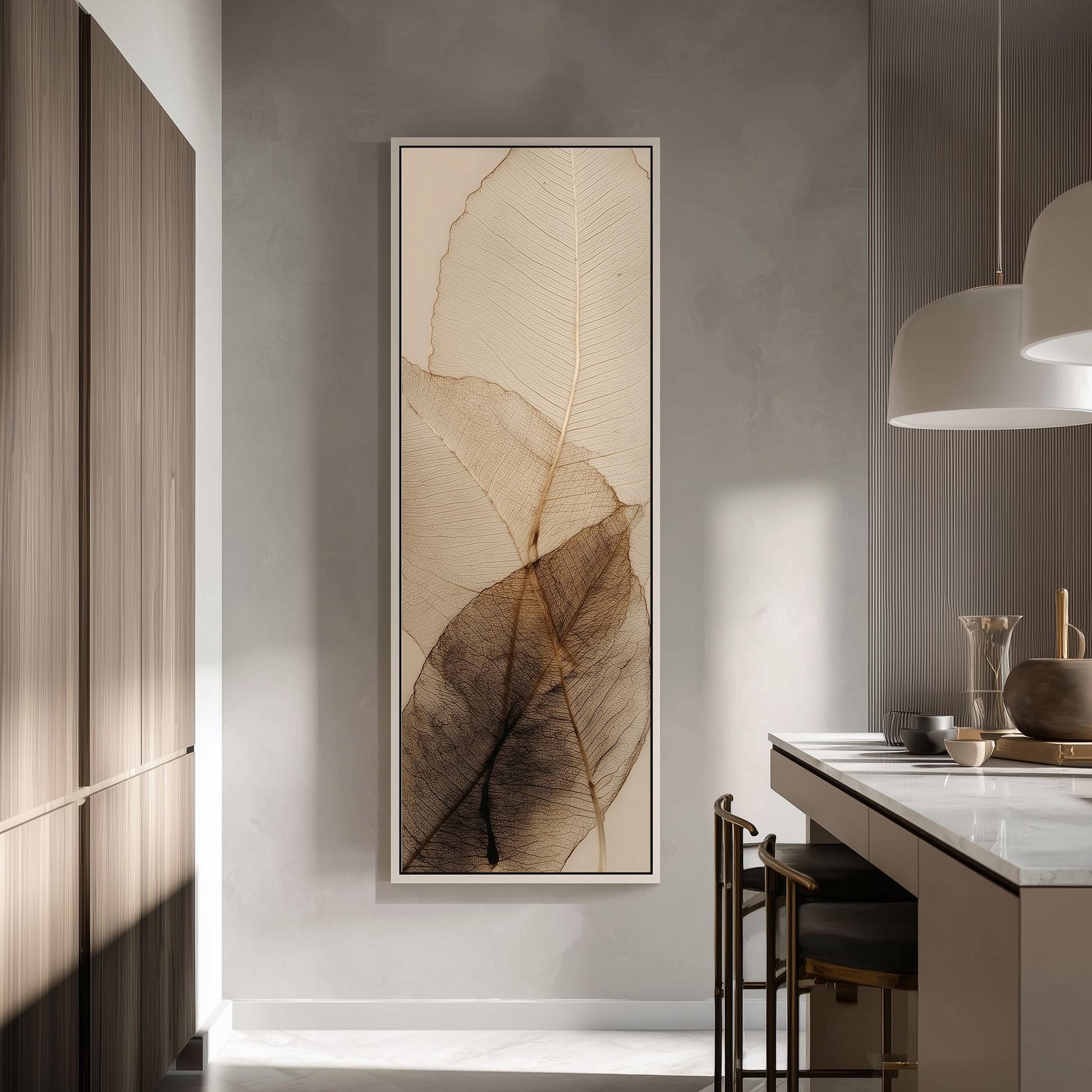 a modern kitchen with a large wall art piece depicting a leaf design in shades of brown and beige. The kitchen has a minimalist design with a white countertop and wooden cabinets.