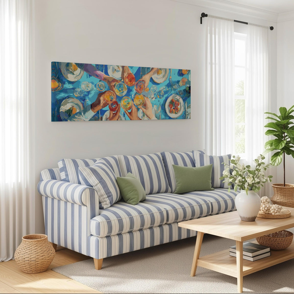 Friends toasting over a blue table from above long horizontal canvas print above a striped sofa in a coastal living room