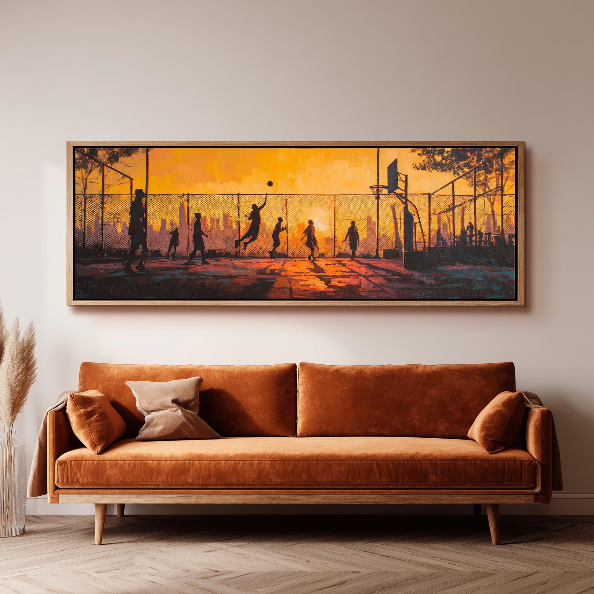 a large painting of people playing basketball on a court, with silhouettes of the players against a sunset-like background.