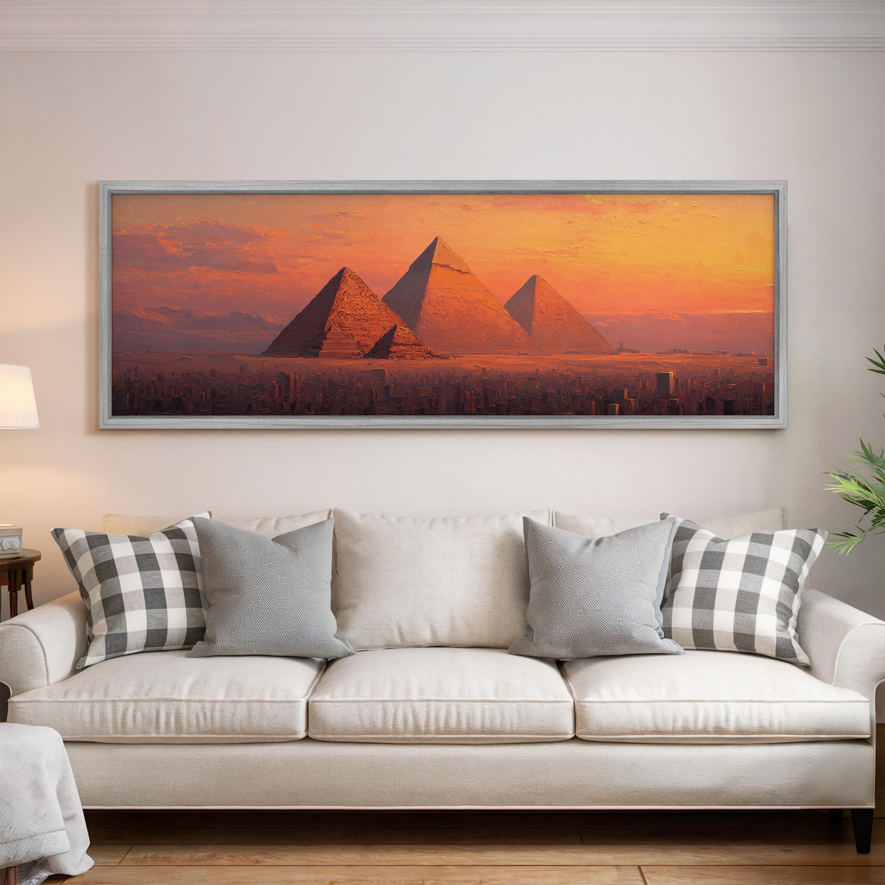 a large framed picture of the pyramids of Giza in Egypt, with a warm sunset in the background.