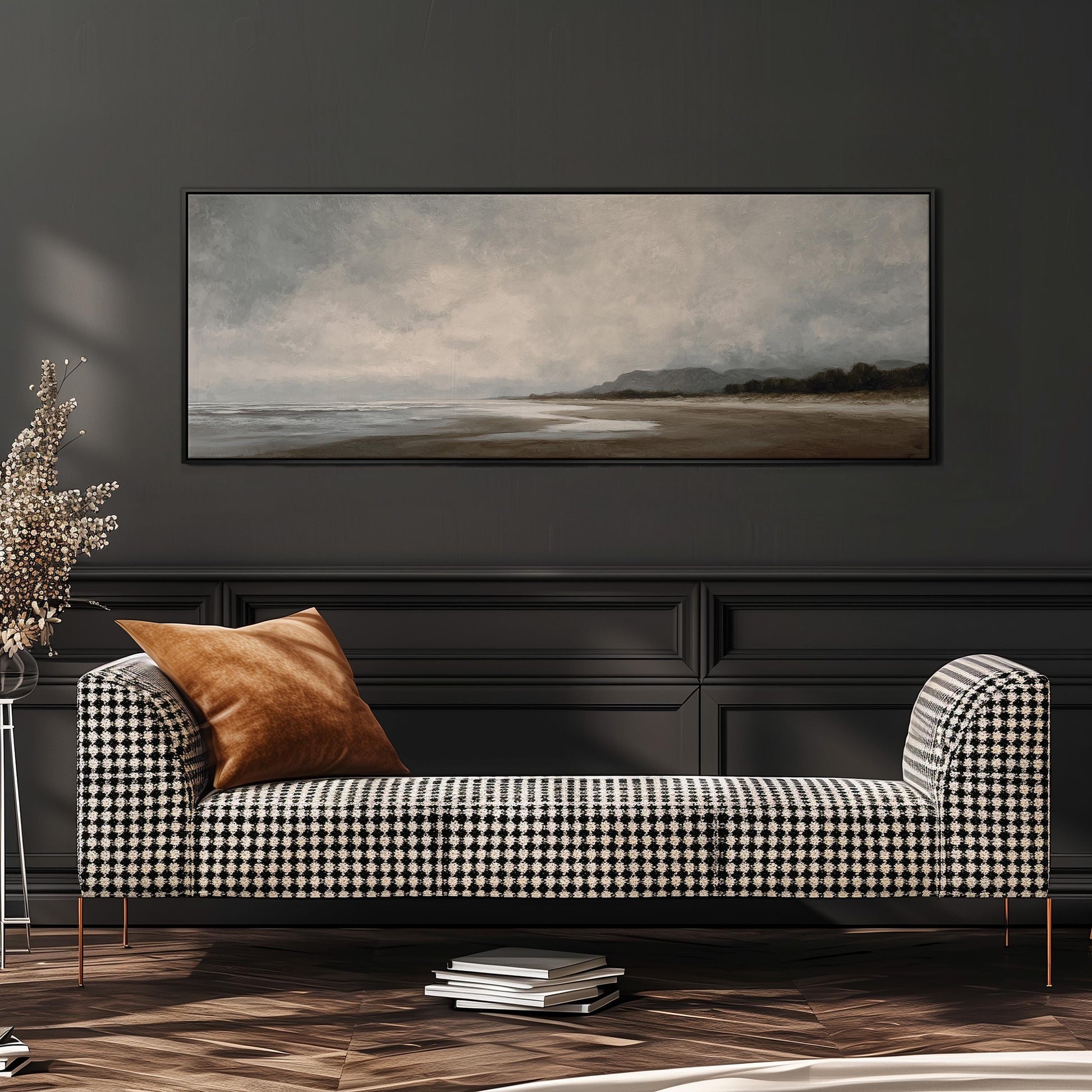 a black and white checkered sofa with a brown throw pillow, positioned in front of a large painting depicting a beach scene.