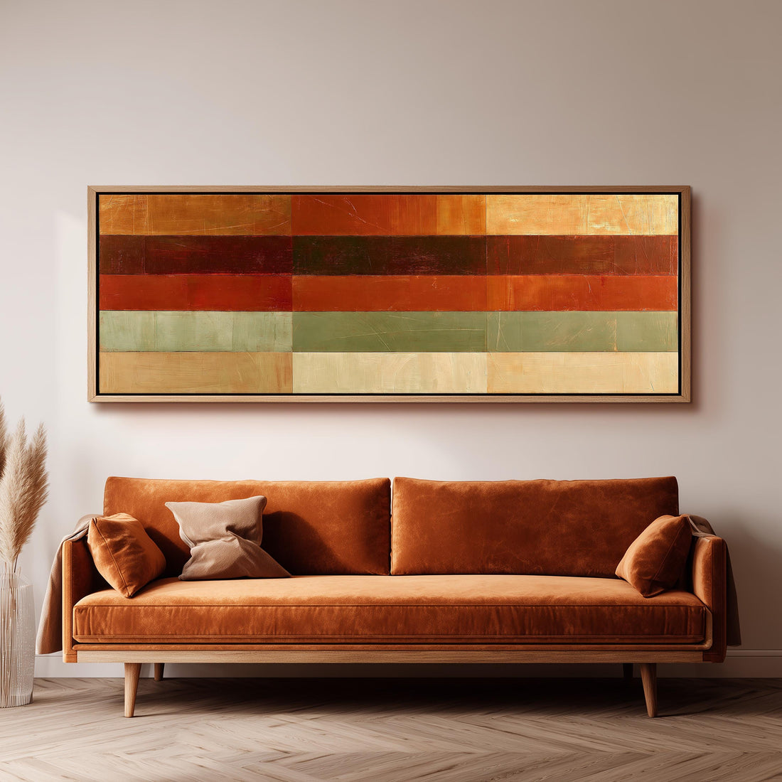 Amber, rust and sage horizontal color bands long horizontal canvas print above a sofa in a living room