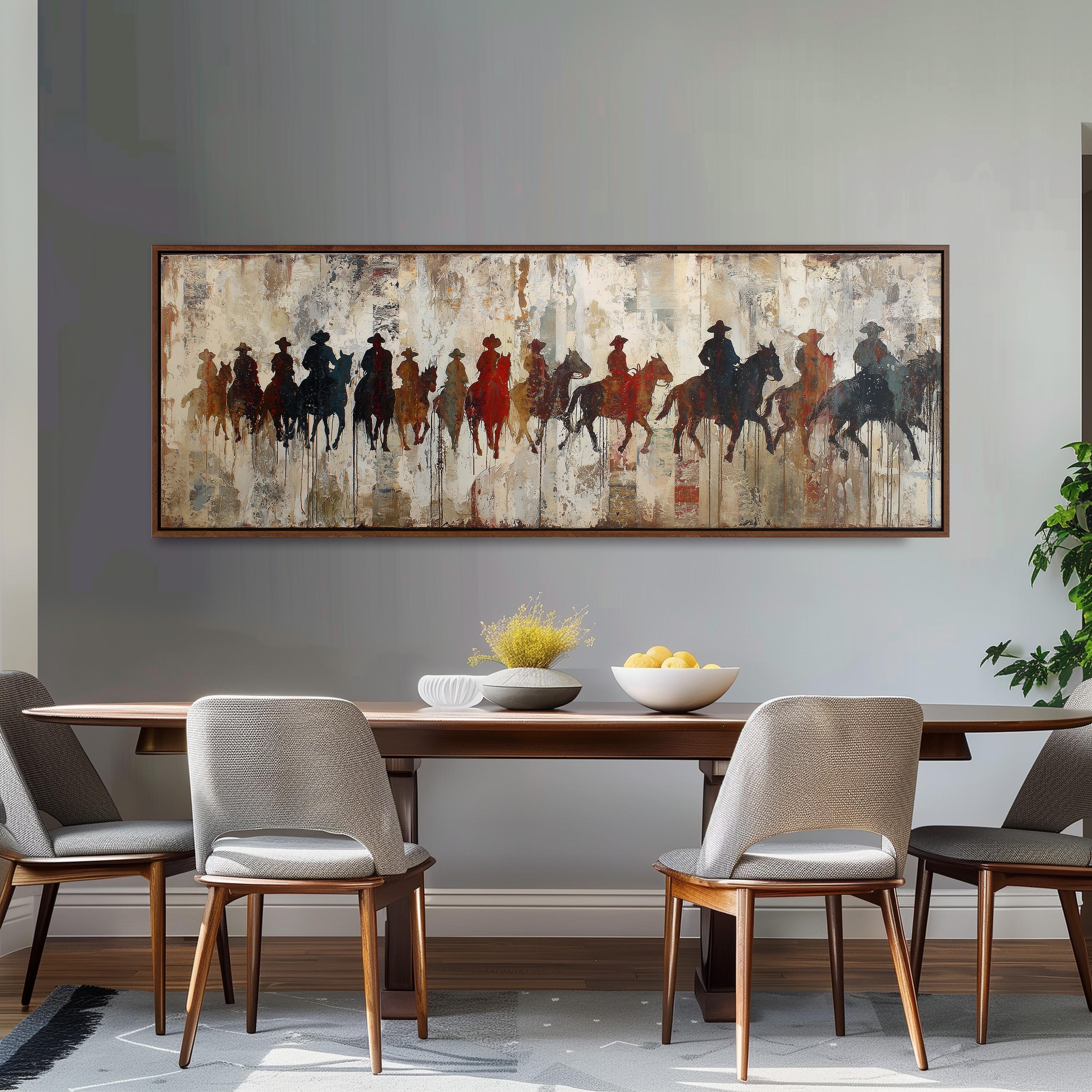 a dining room with a large painting of cowboys on the wall above a wooden dining table with four chairs. The painting depicts a group of cowboys on horseback, creating a western-themed atmosphere.