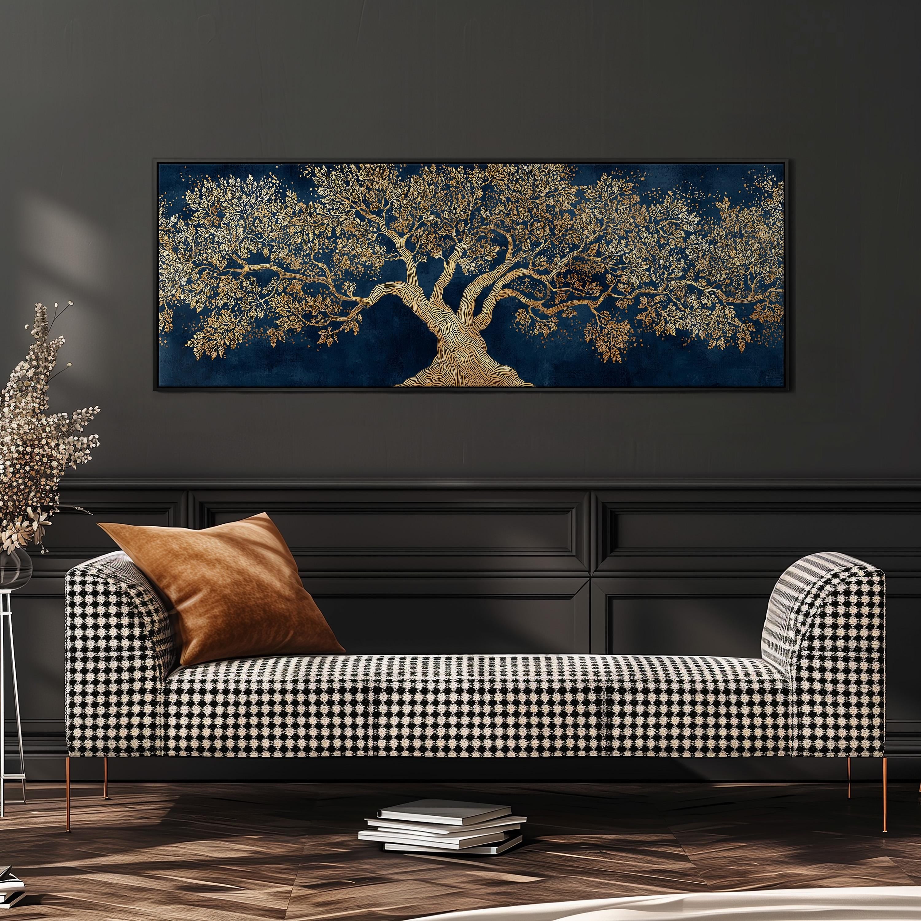 a large, ornate tree painting hanging on a dark wall above a black and white checkered sofa with a brown throw pillow.