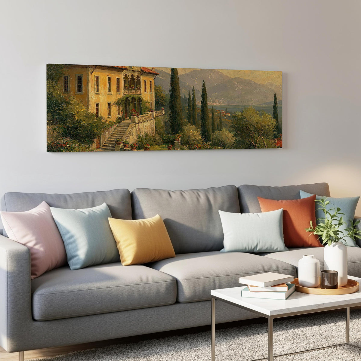 Tuscan villa among cypress hills panoramic canvas print above a grey sofa in a living room