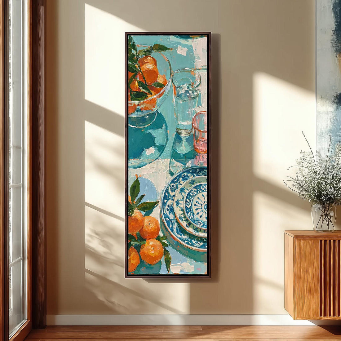 Citrus fruit and blue plates on a table long vertical canvas print in a sunlit living space