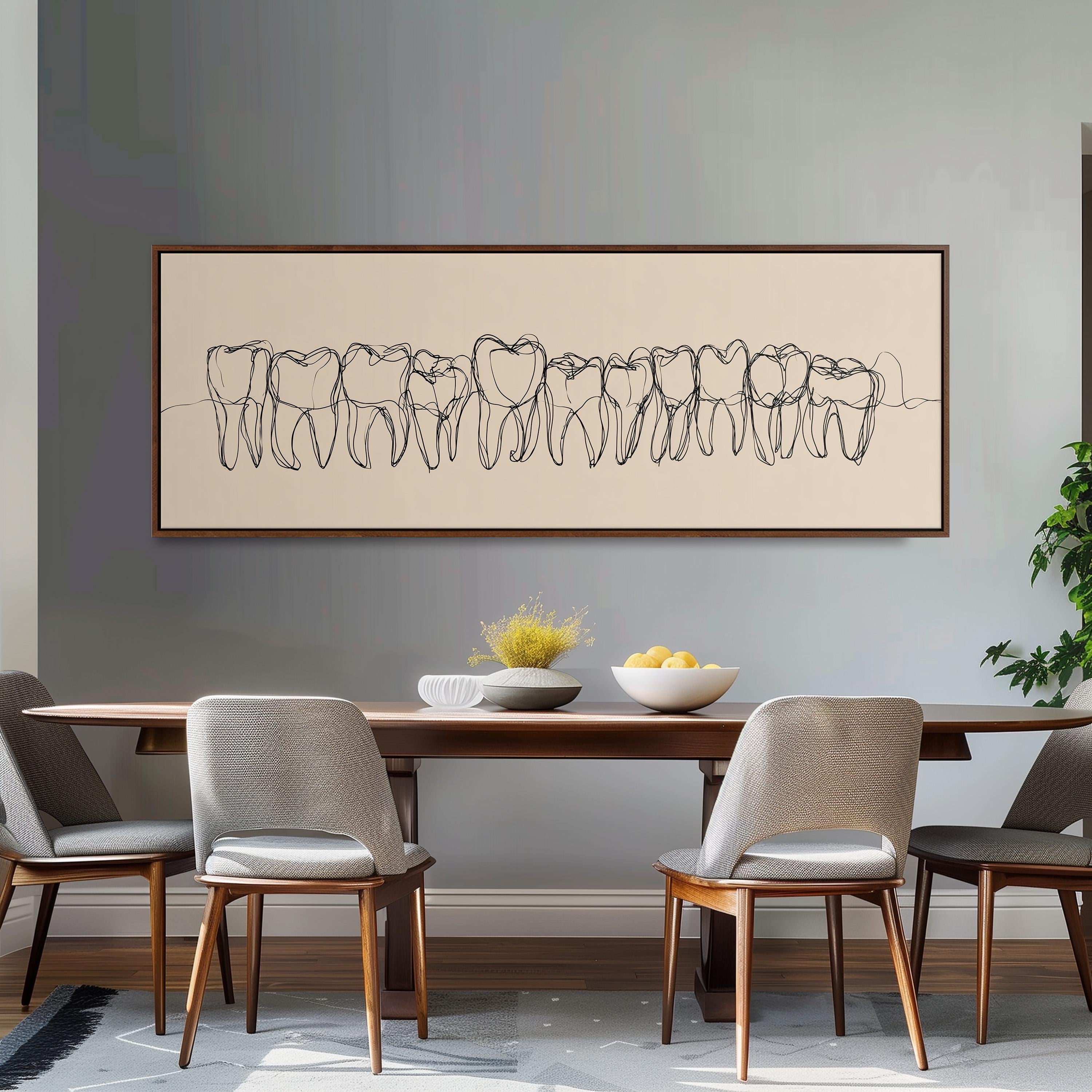 a dining room with a wooden table and four chairs. Above the table, there is a large framed artwork depicting a line of teeth. The table is set with a bowl of fruit and a vase of flowers.