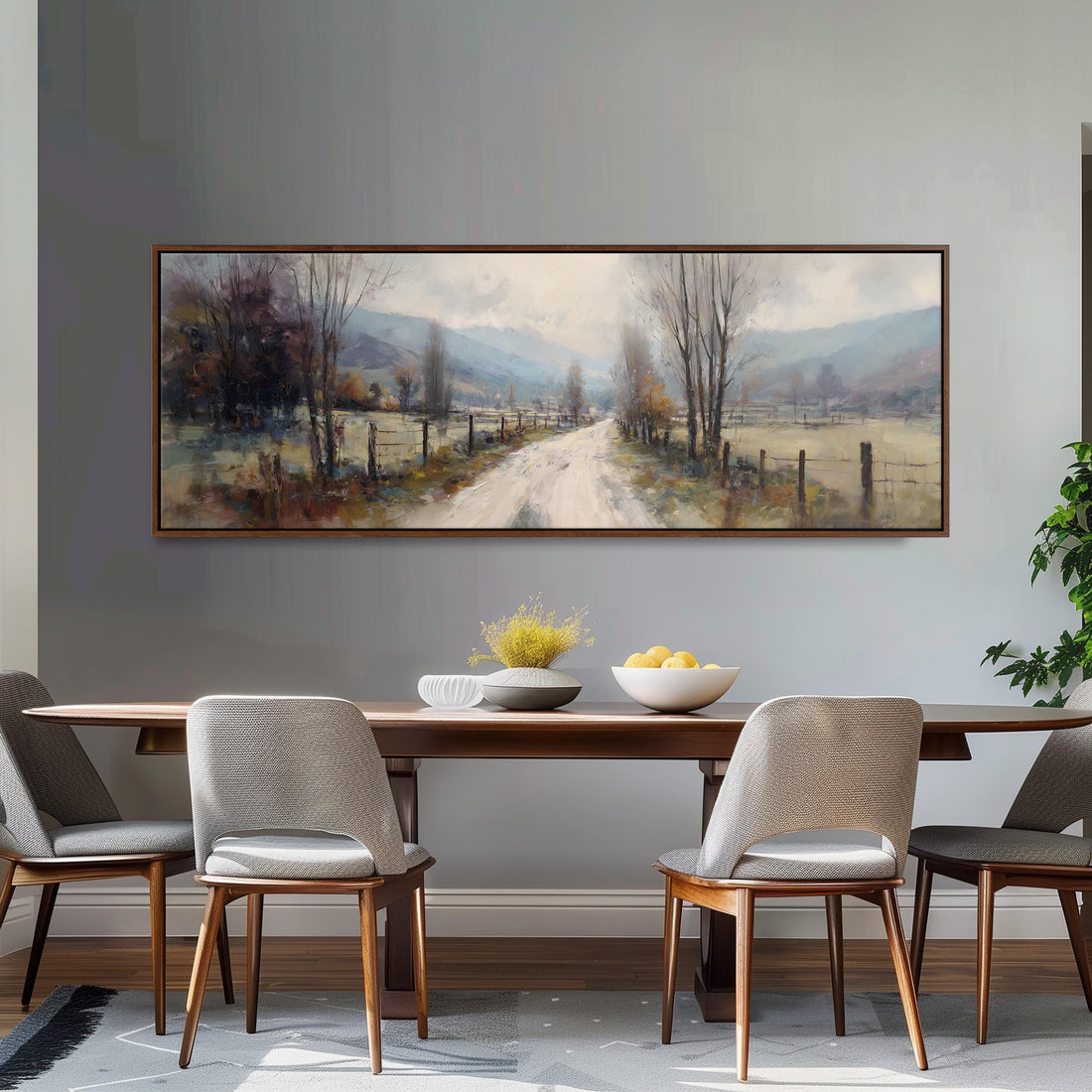a large painting of a rural road with trees and a fence, hanging on a wall above a black and white checkered sofa.