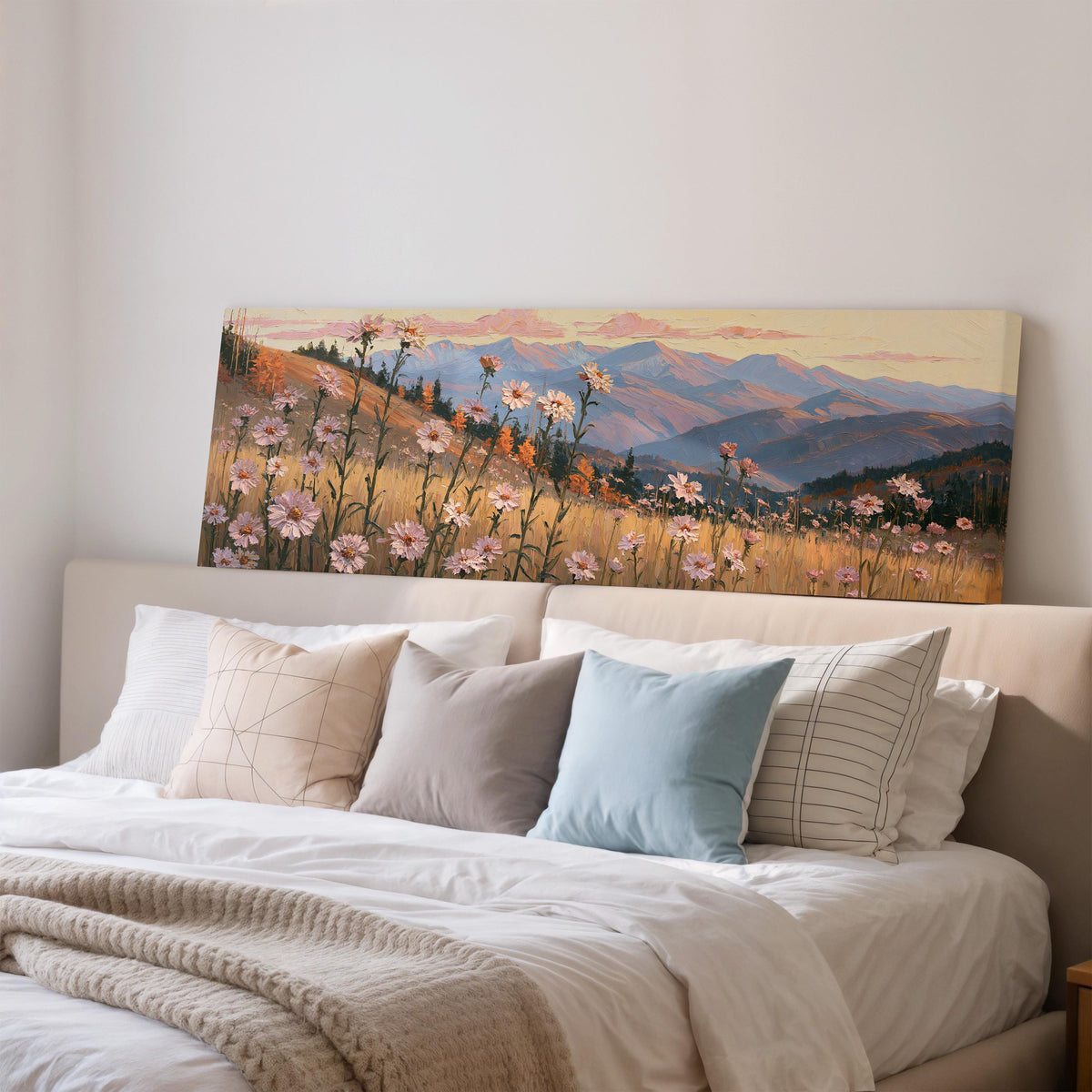 Wildflower meadow with mountains wide panoramic canvas print above a bed in a bedroom