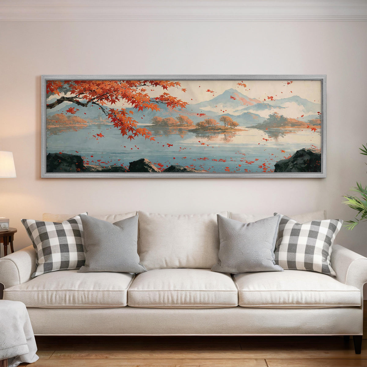Japanese maple over a misty lake panoramic canvas print above a white sofa in a bright living room