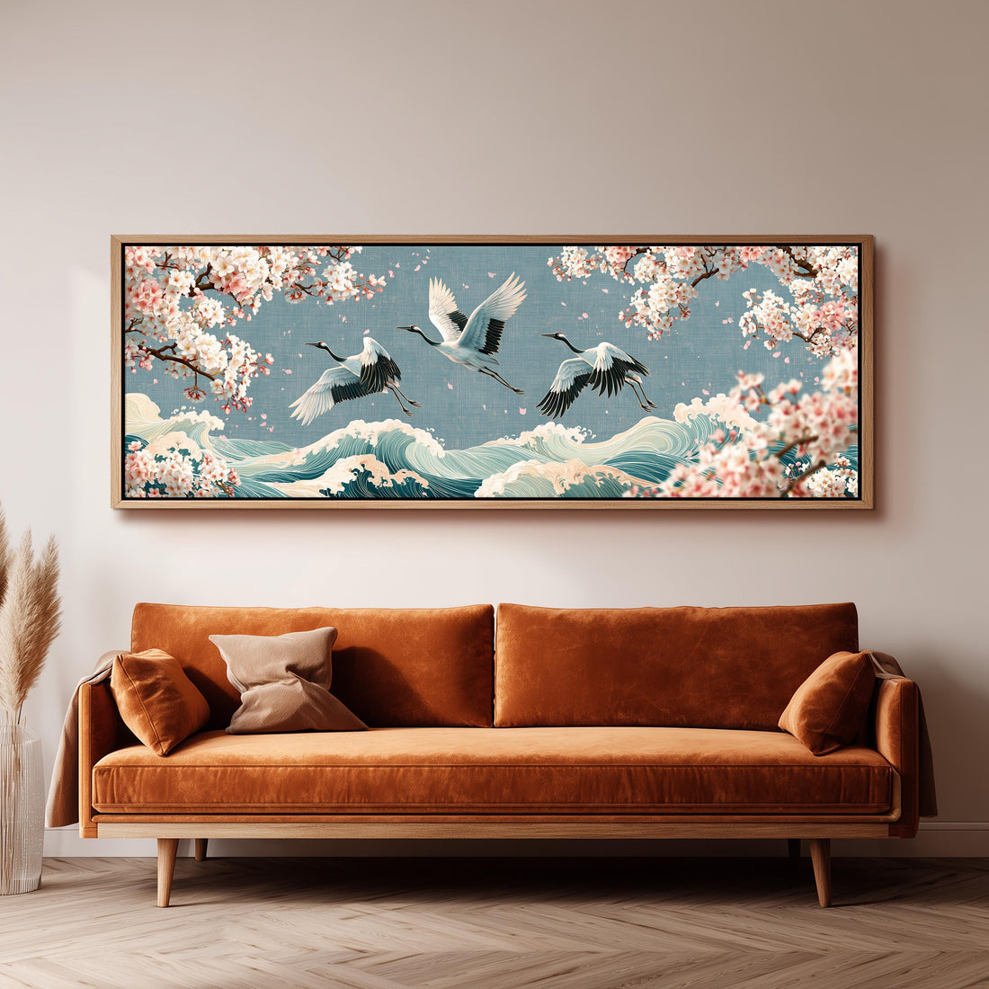 Cranes flying over waves and cherry blossoms long horizontal canvas print above a sofa in a living room