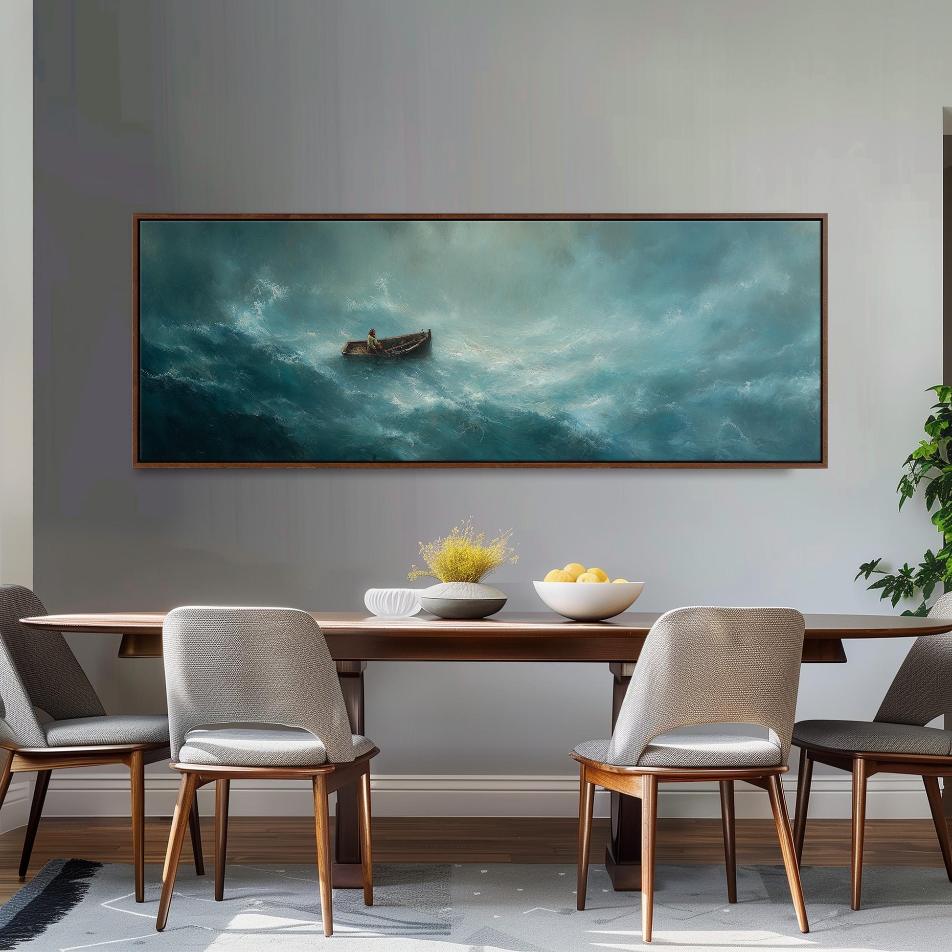 a large painting of a boat sailing on a stormy sea, hanging on a wall above a wooden dining table with four chairs.