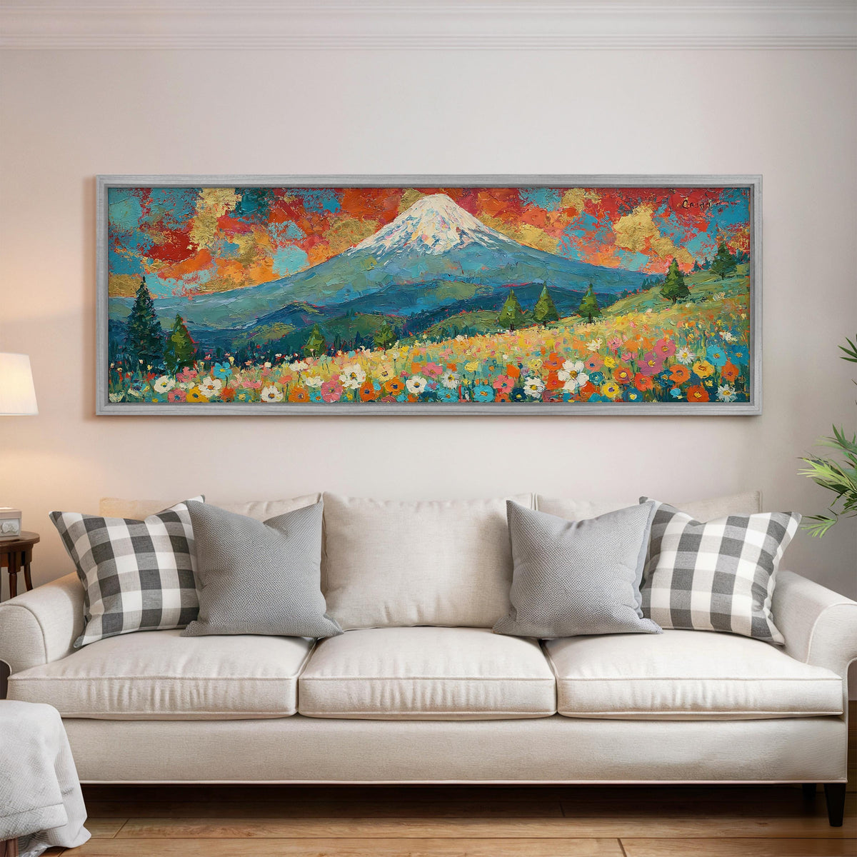 Mount Fuji under a red and gold sunset sky panoramic canvas print above a white sofa in a bright living room