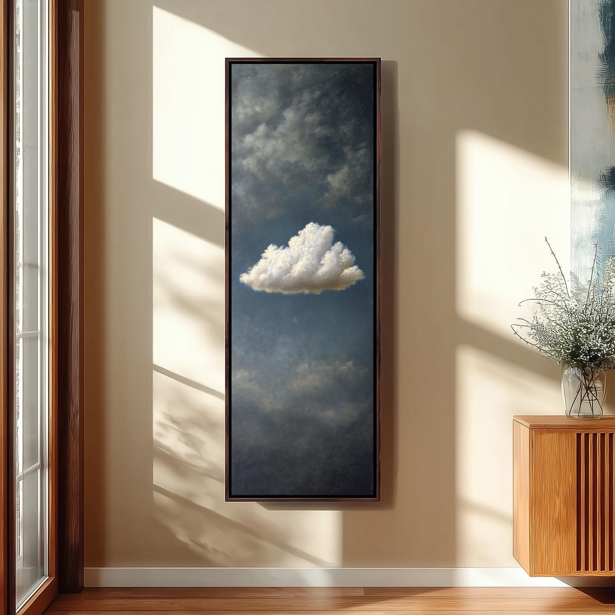 a large, framed painting of a cloud hanging on a wall in a room with wooden furniture.
