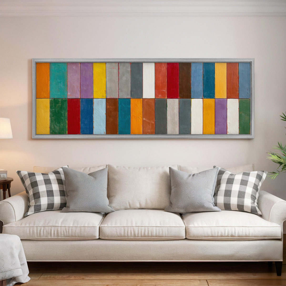 Bright color block rows panoramic canvas print above a white sofa in a bright living room
