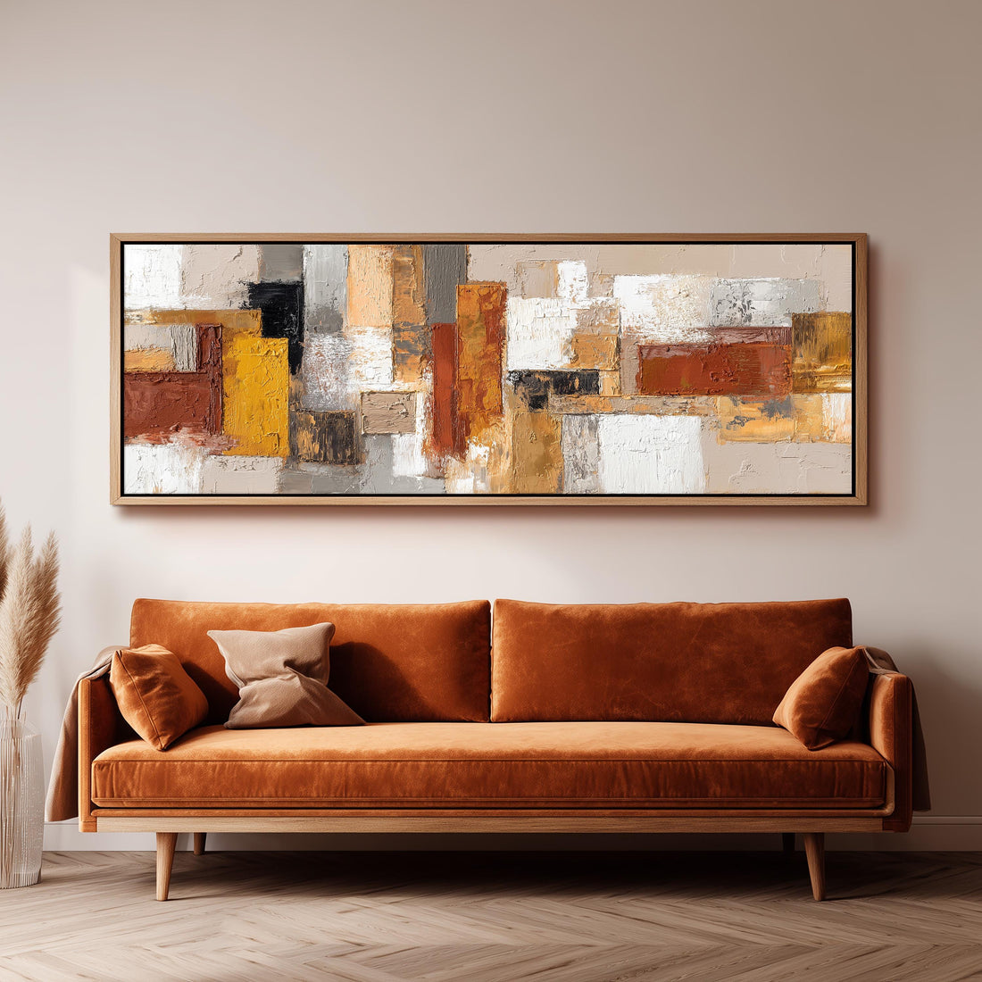 a dining room with a large abstract painting hanging on the wall above a wooden table with four chairs. The table is set with a bowl of fruit and a vase of flowers, creating a warm and inviting atmosphere.