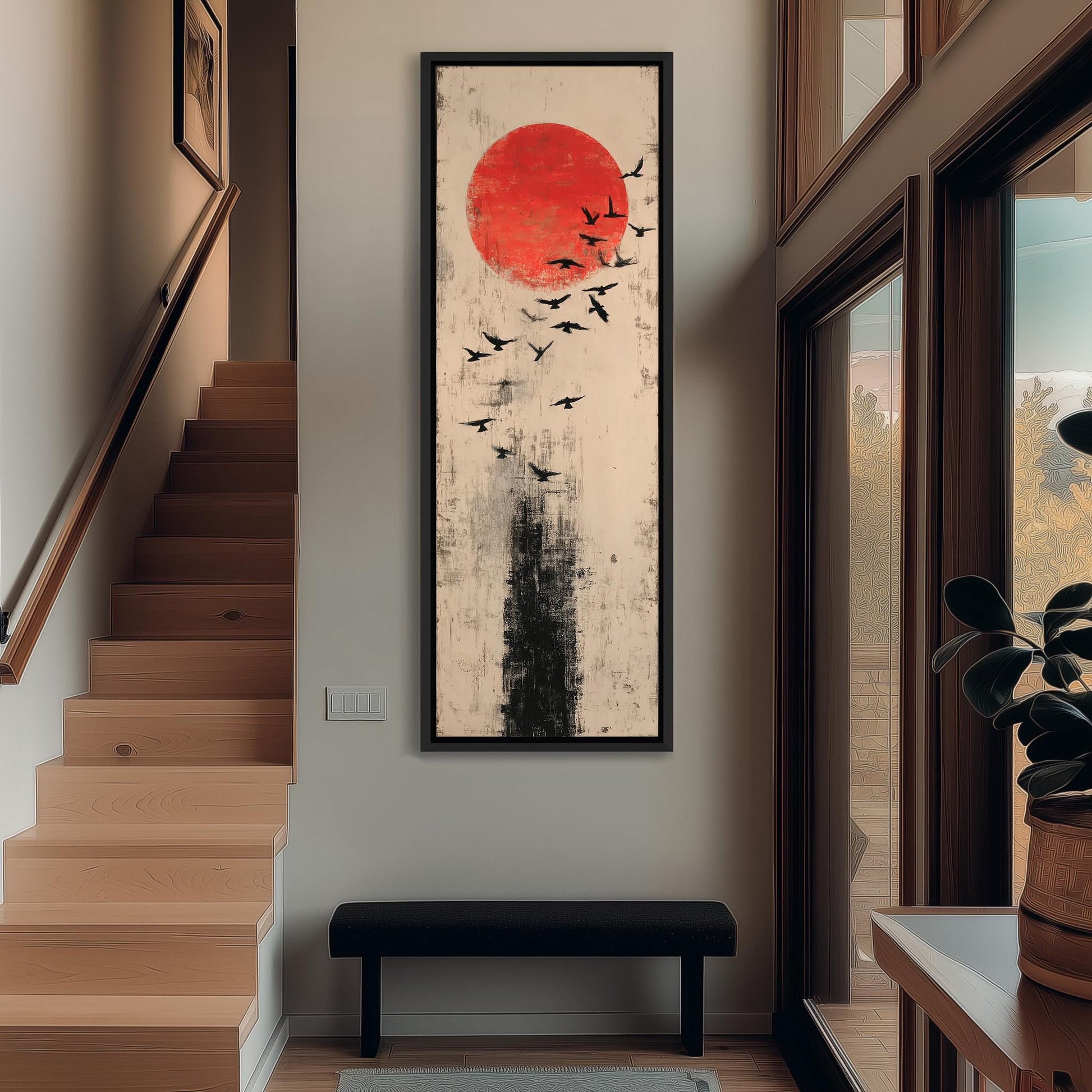 a large, abstract painting hanging on the wall of a hallway. The painting depicts a red circle with a black sunburst in the center, surrounded by a flock of black birds. The hallway has wooden stairs leading up to the painting, and a black bench is situated in front of the painting.
