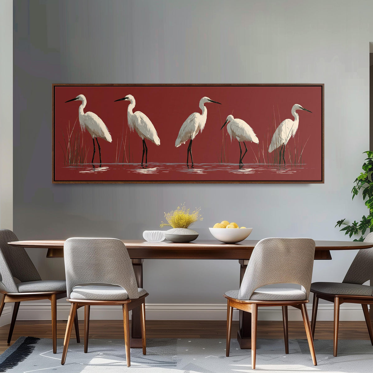 White egrets wading on crimson red long horizontal canvas print above a dining table