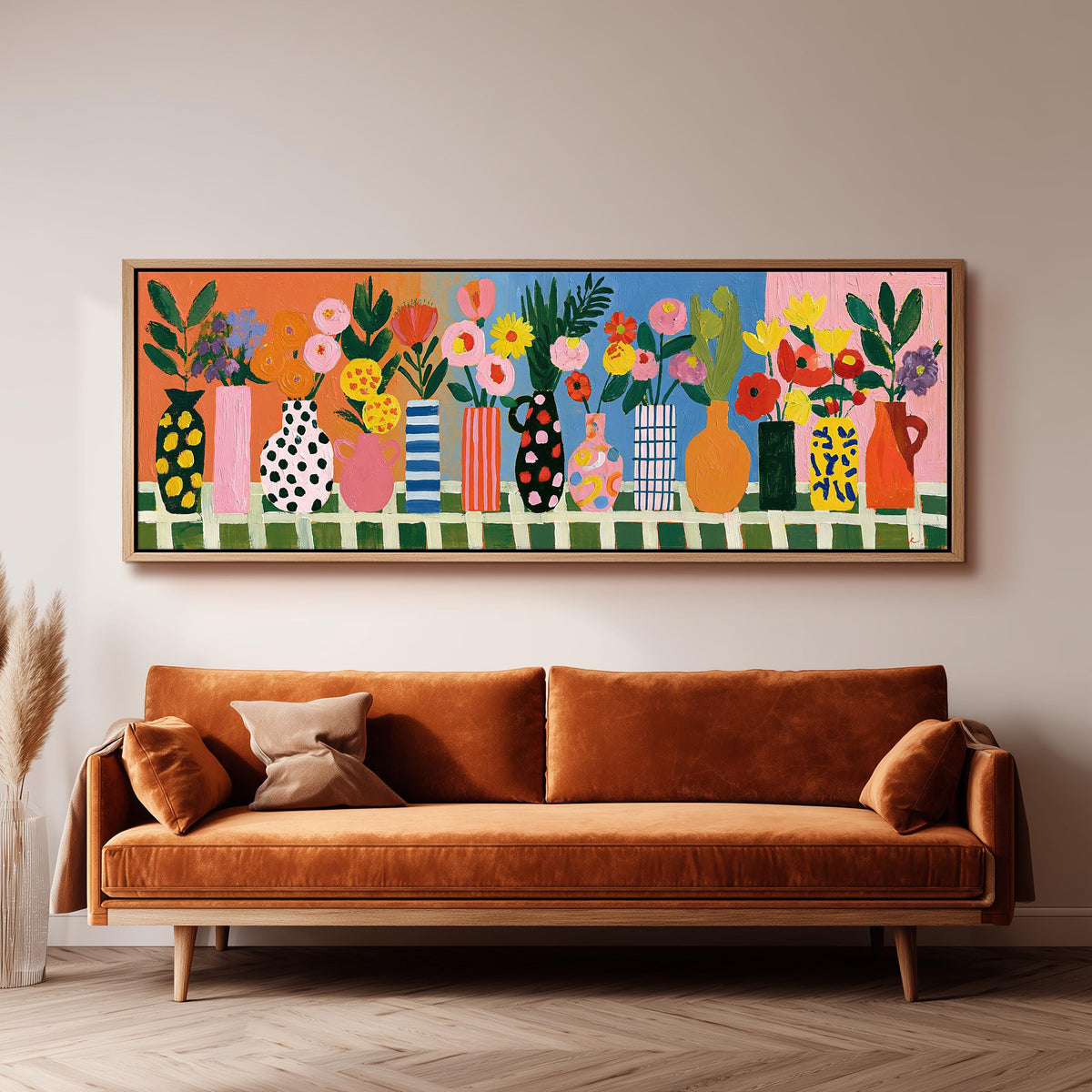 Patterned vases with bright bouquets long horizontal canvas print above a sofa in a living room