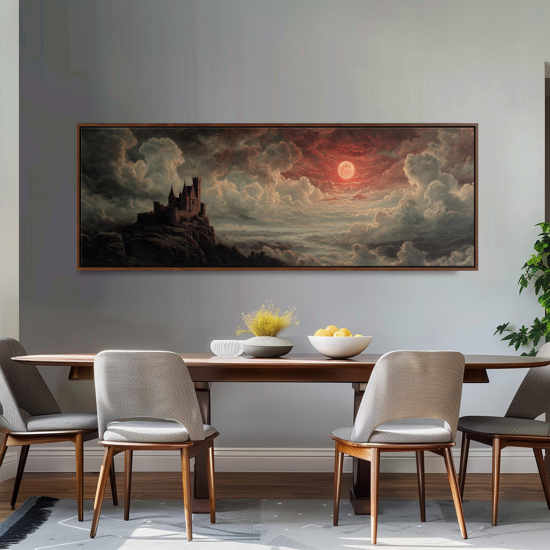 a large painting of a castle on a cliff, with a dramatic sky and clouds in the background. The painting is hanging on a wall above a black and white checkered sofa, which has a brown throw pillow on it. There are also some books on the floor in front of the sofa.