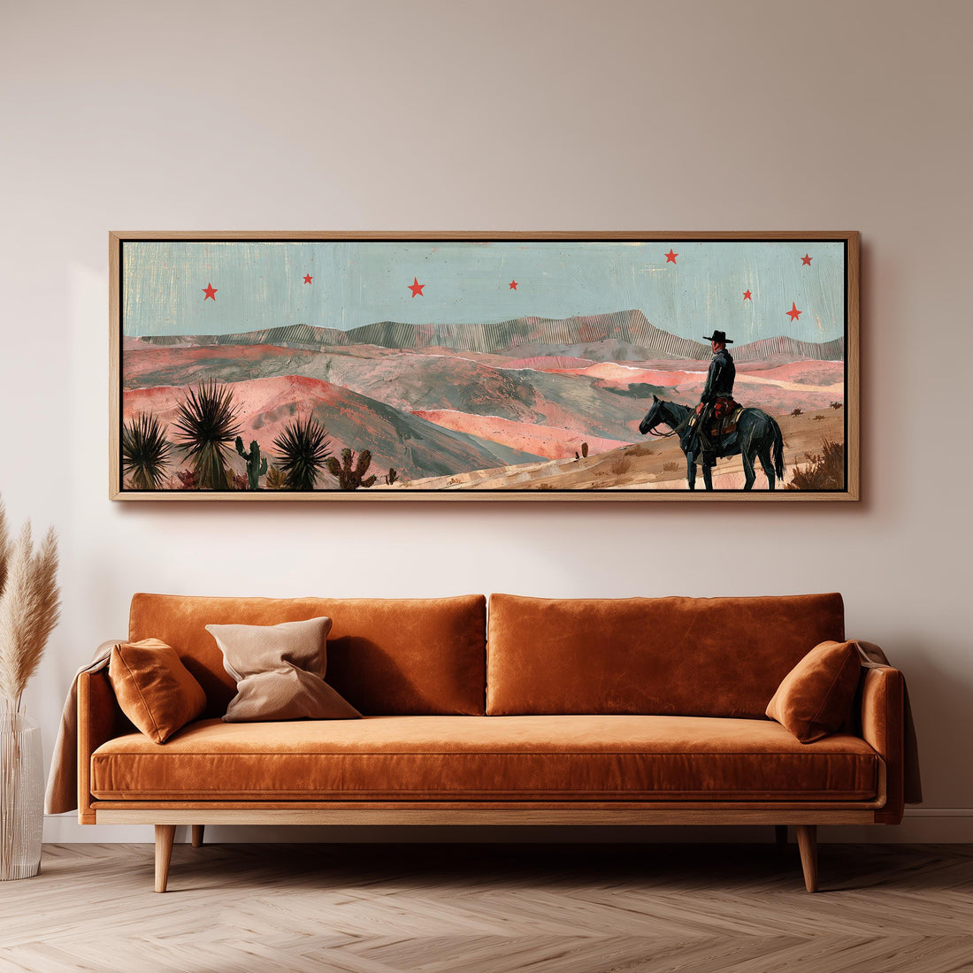Desert cowboy under red stars long horizontal canvas print above a sofa in a living room