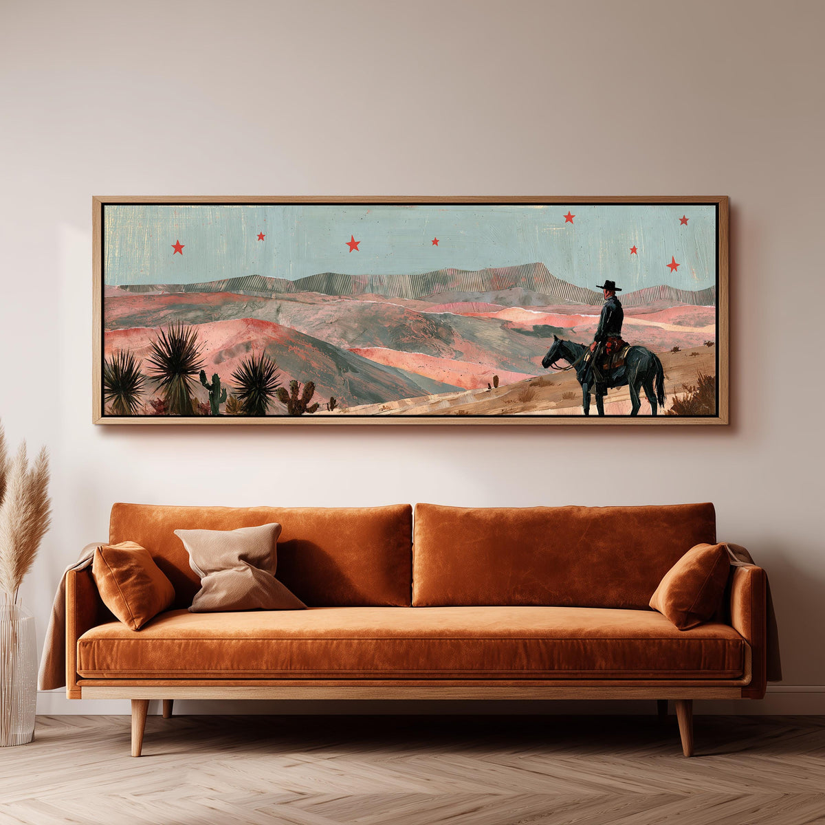 Desert cowboy under red stars long horizontal canvas print above a sofa in a living room