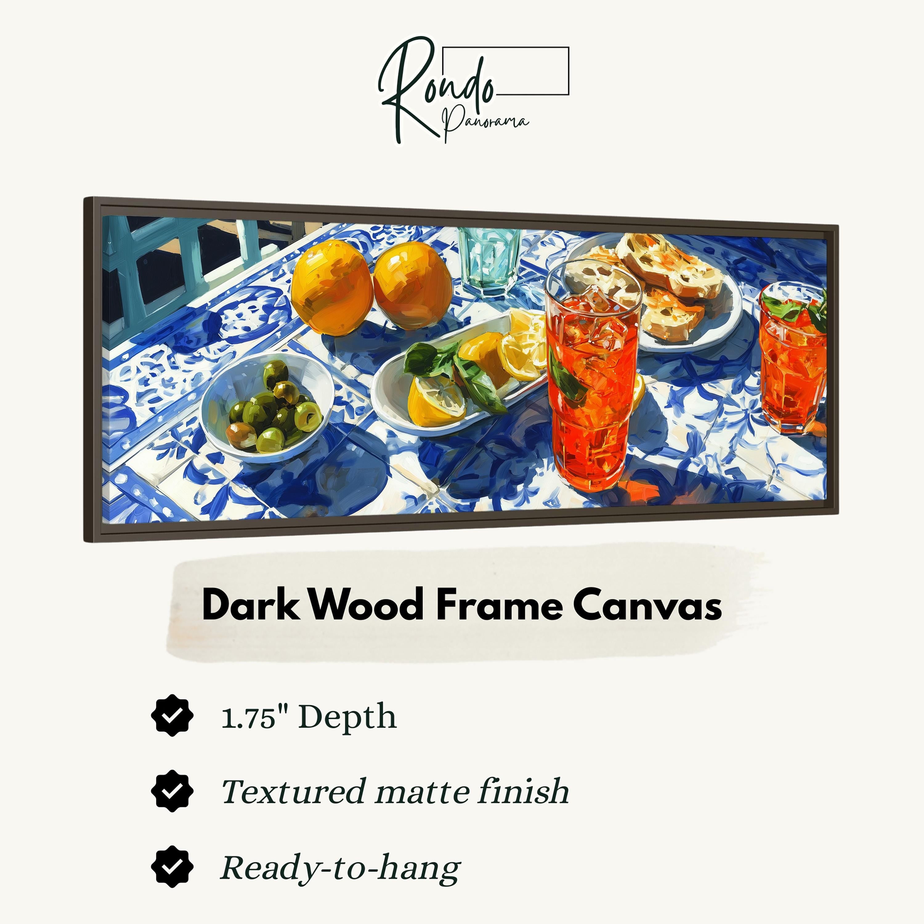 The image is a dark wood frame canvas featuring a painting of a table with various food items, including oranges, a bowl of olives, and a glass of orange juice.