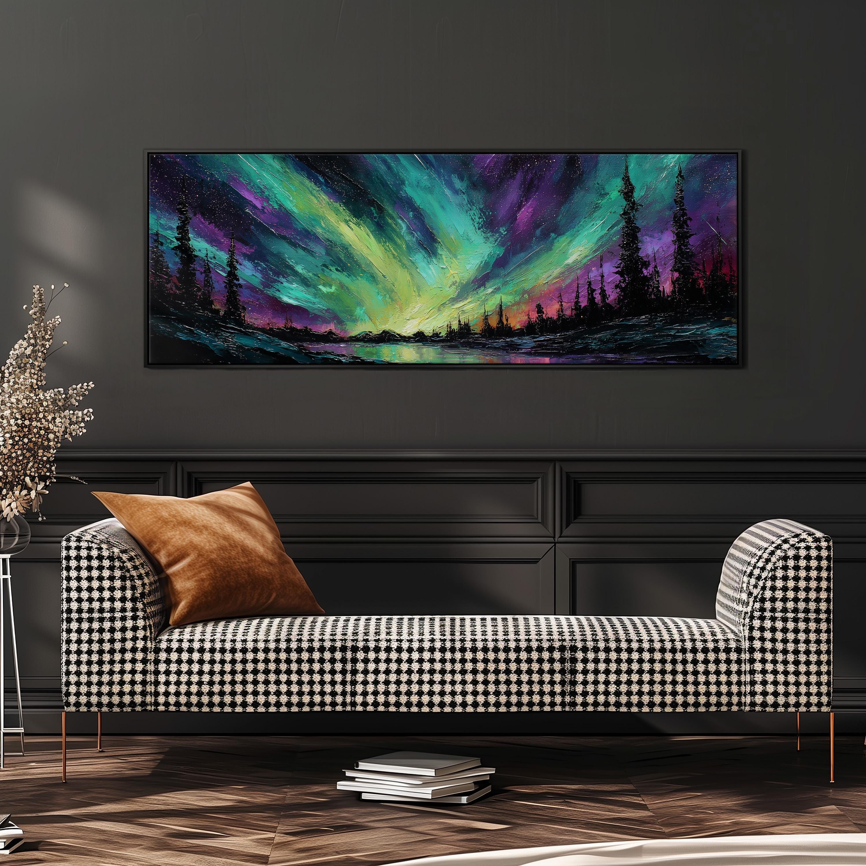 a large, colorful painting of a night sky with a vibrant display of green, purple, and blue hues, depicting a stunning celestial landscape. The painting is hung on a wall above a black and white checkered sofa, which is positioned in front of a stack of books. The overall scene creates a cozy and inviting atmosphere in the room.