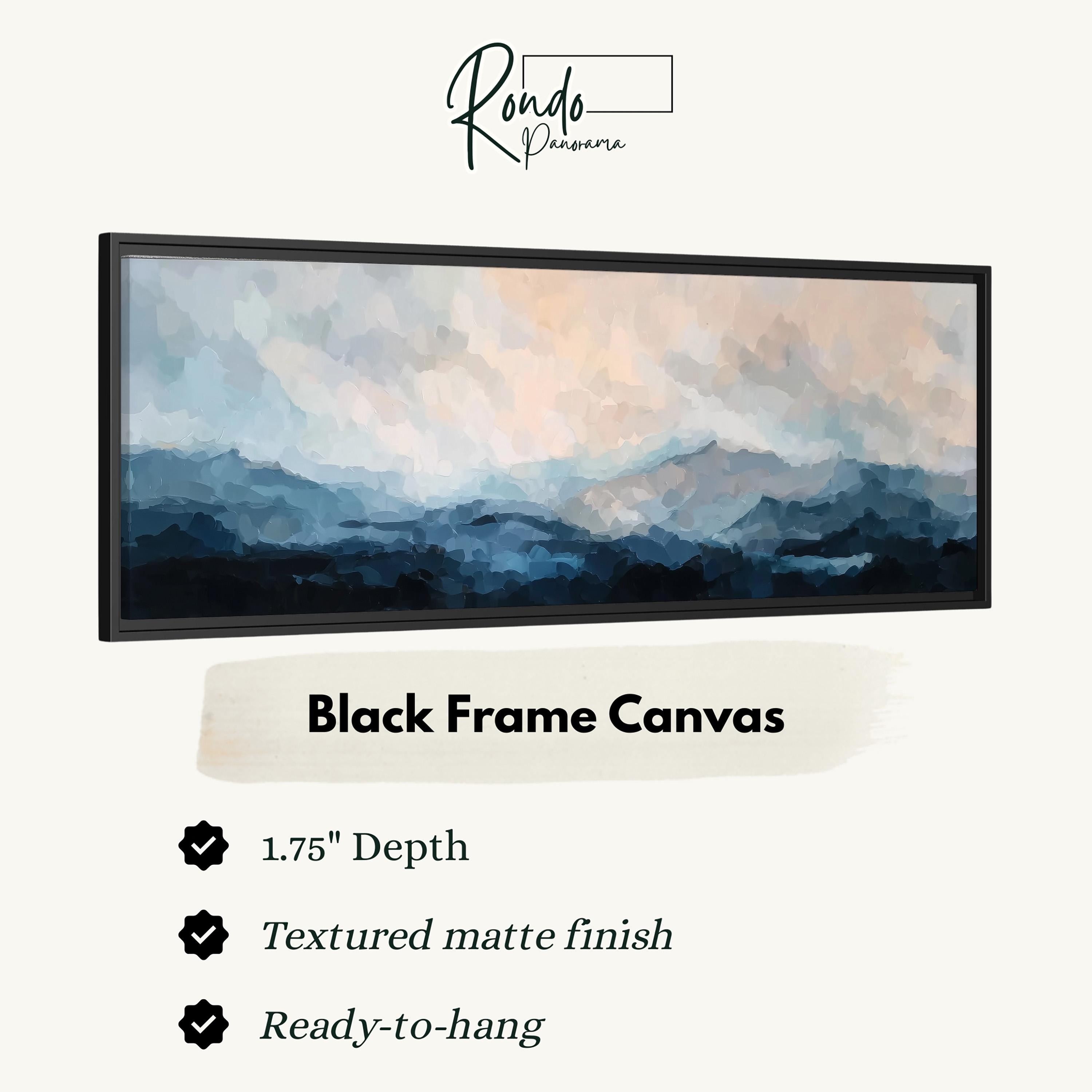 The image is a black frame canvas depicting a landscape with mountains and a cloudy sky.
