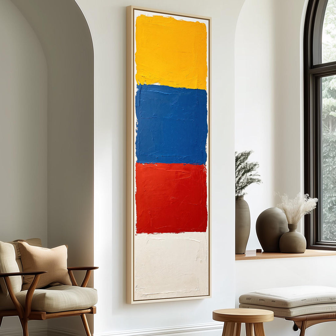 Color field blocks in yellow, blue and red long vertical canvas print in a sunlit living space