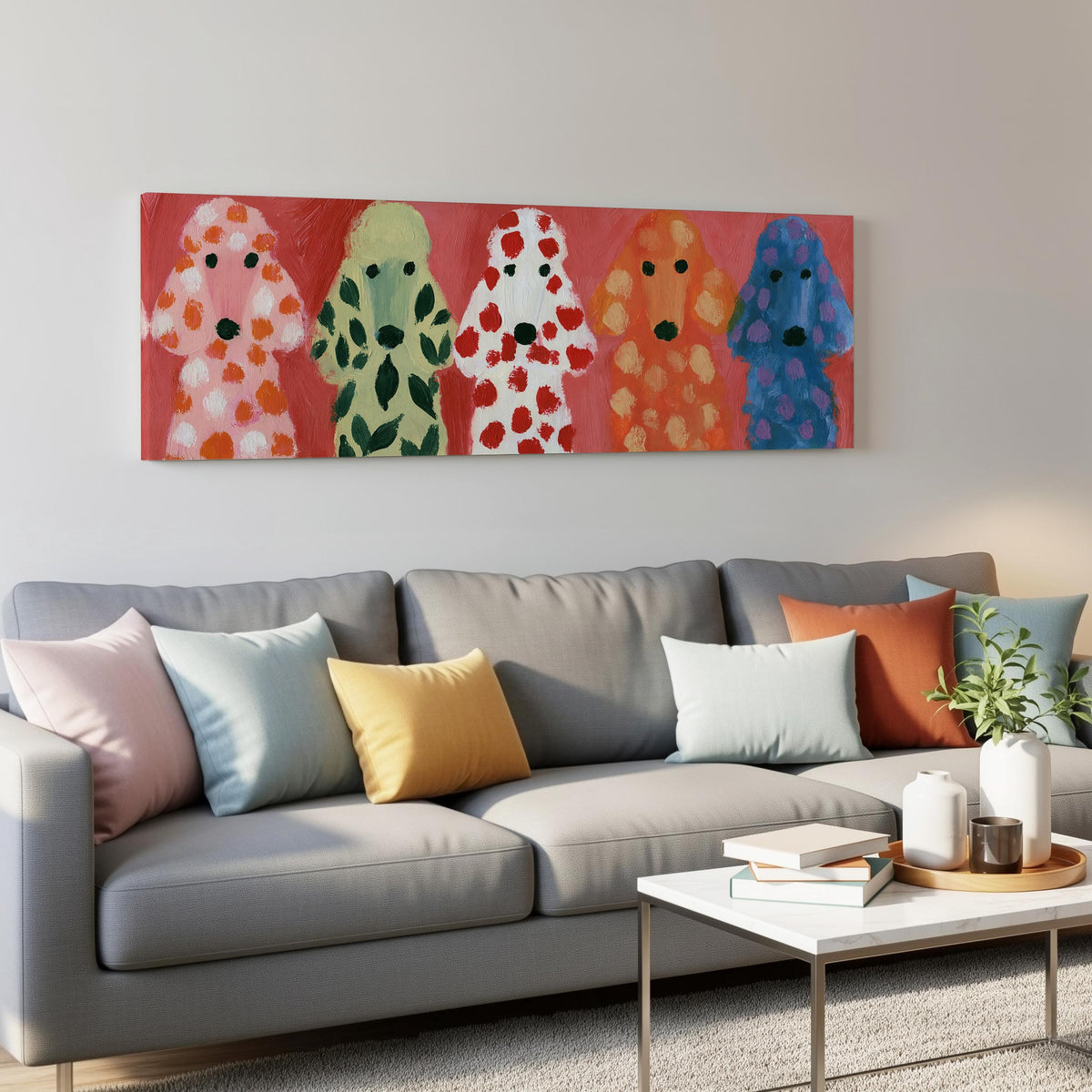 Five colorful poodles panoramic canvas print above a grey sofa in a living room
