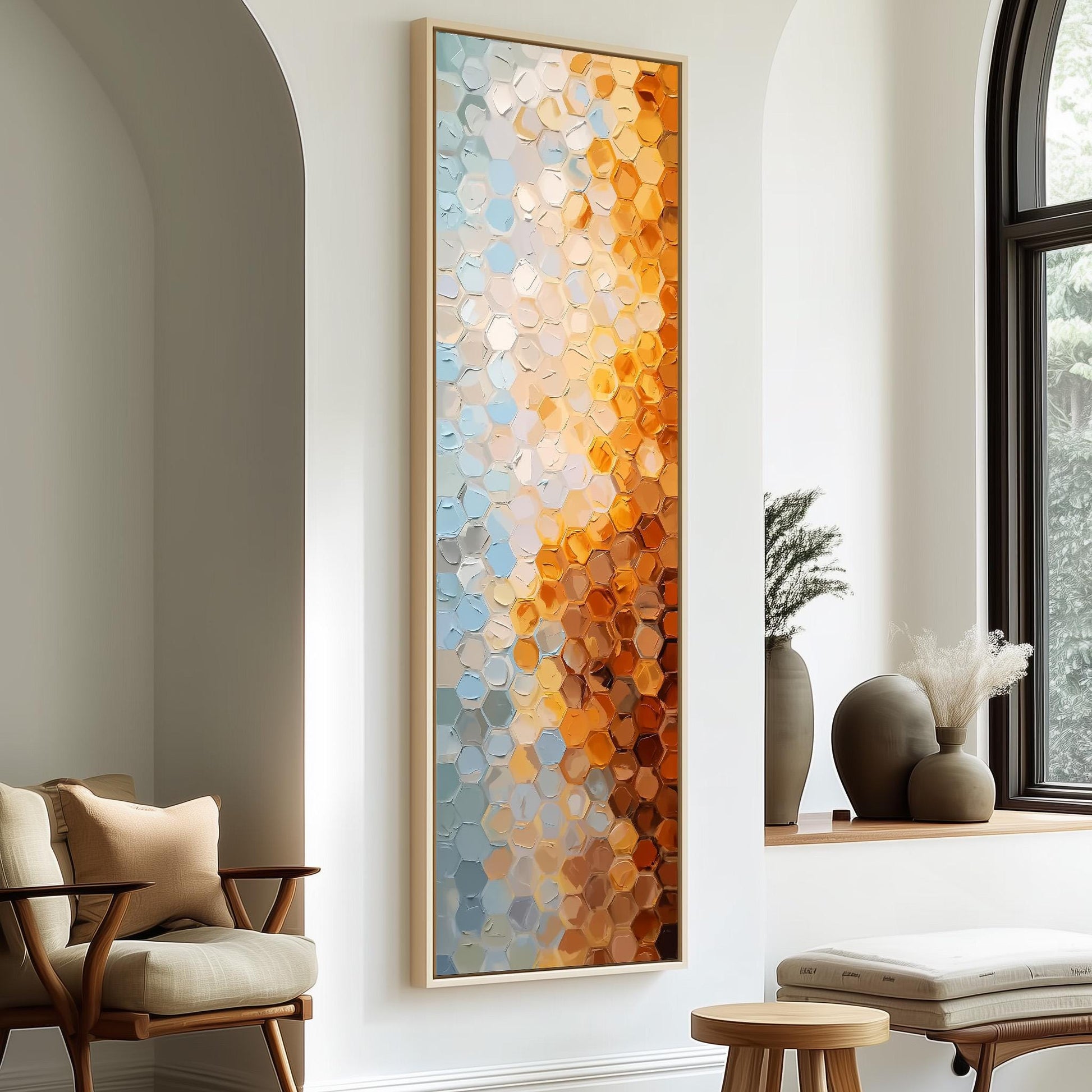 a modern living room with a large abstract painting hanging on the wall, a wooden chair, a small table, and a window with a plant on the sill.