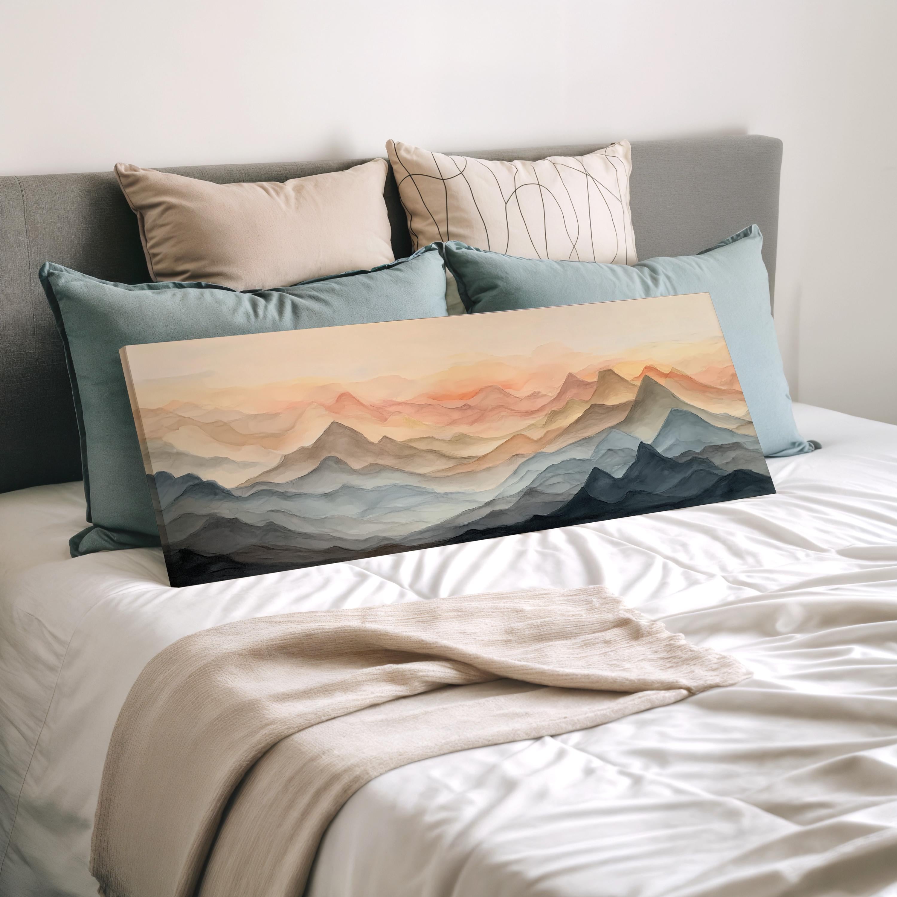 a bedroom with a bed covered in white sheets and a large painting of mountains on the bed. The painting features a landscape with mountains and a sunset sky.