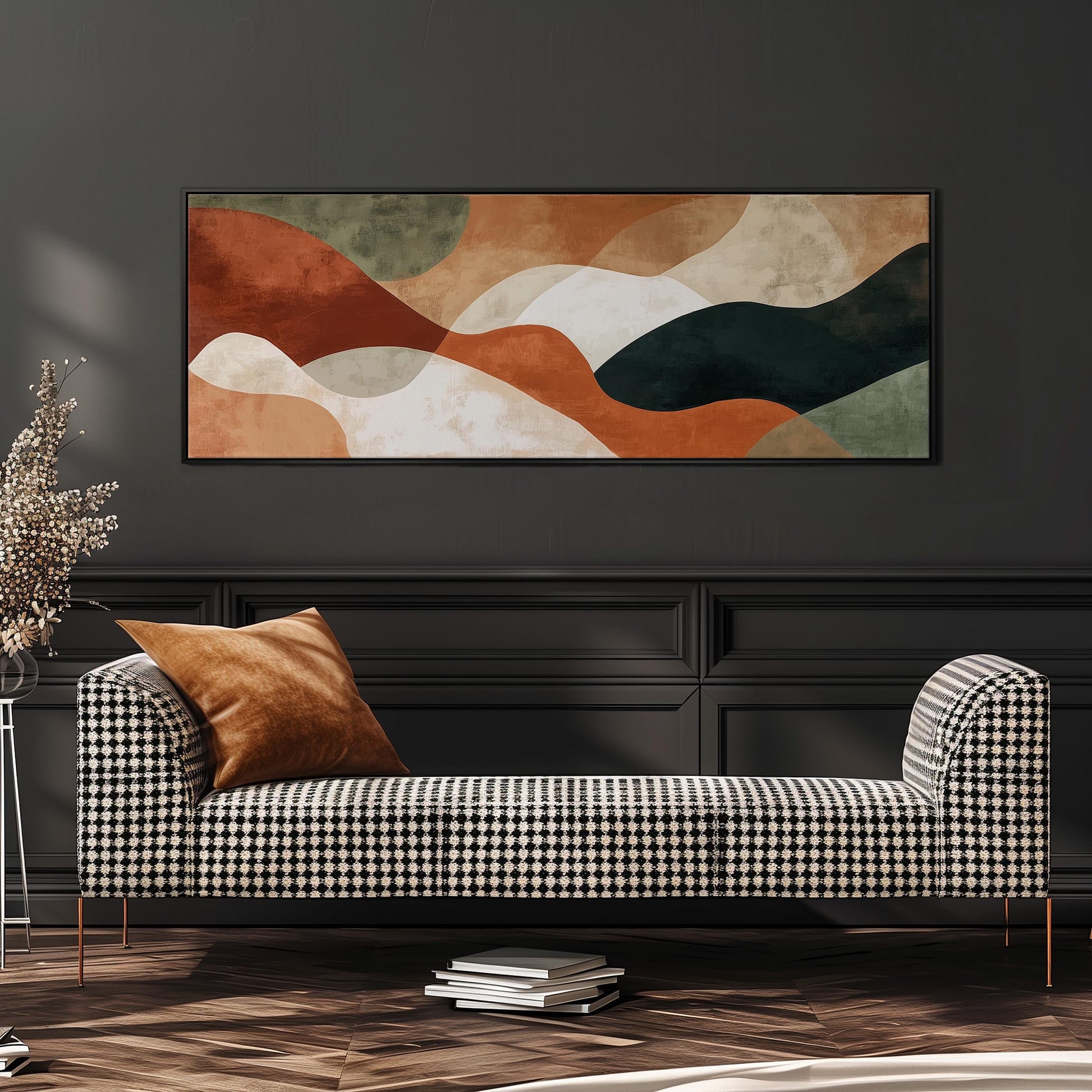 a modern living room with a black and white checkered sofa, a large abstract painting on the wall, and a stack of books on the floor.
