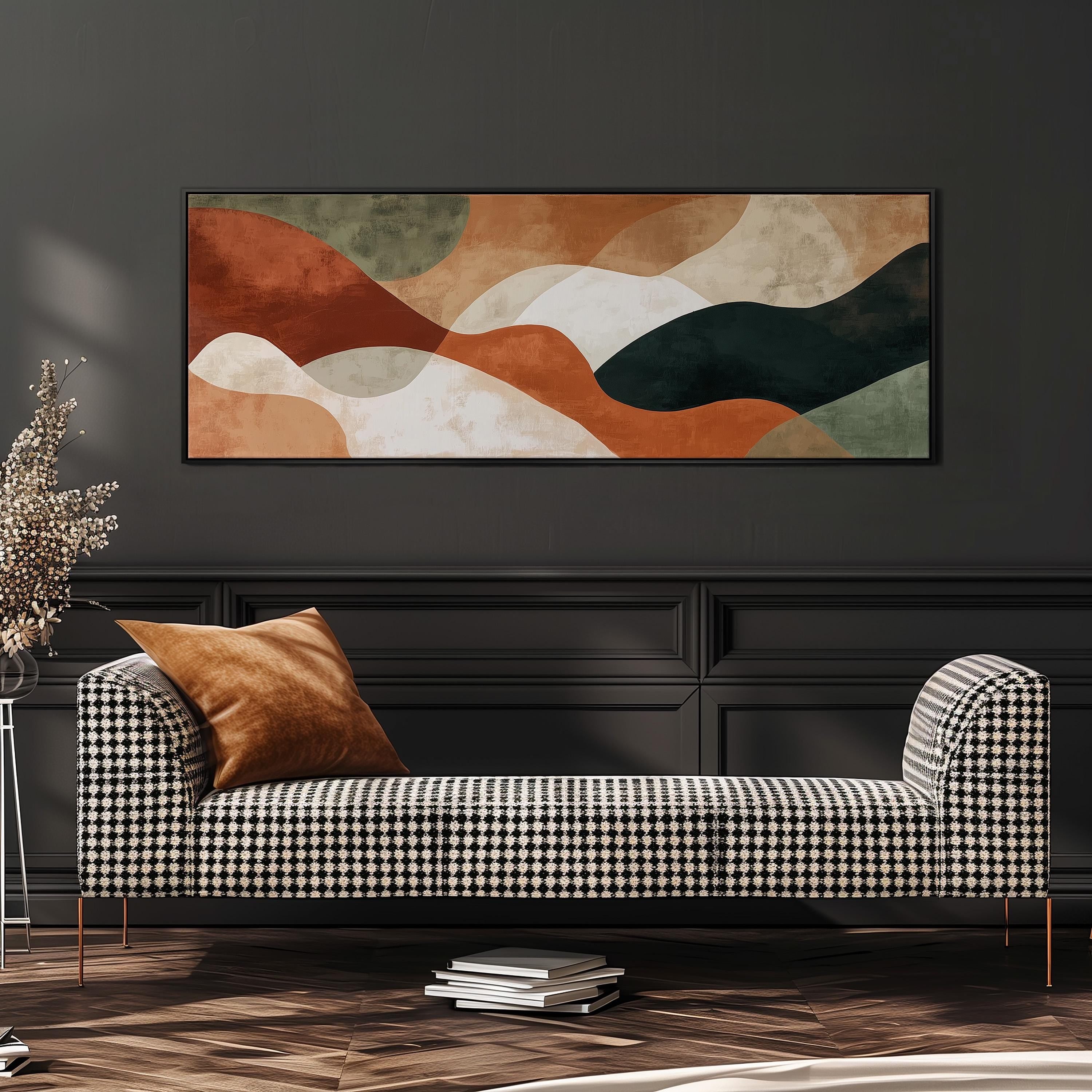 a modern living room with a black and white checkered sofa, a large abstract painting on the wall, and a stack of books on the floor.