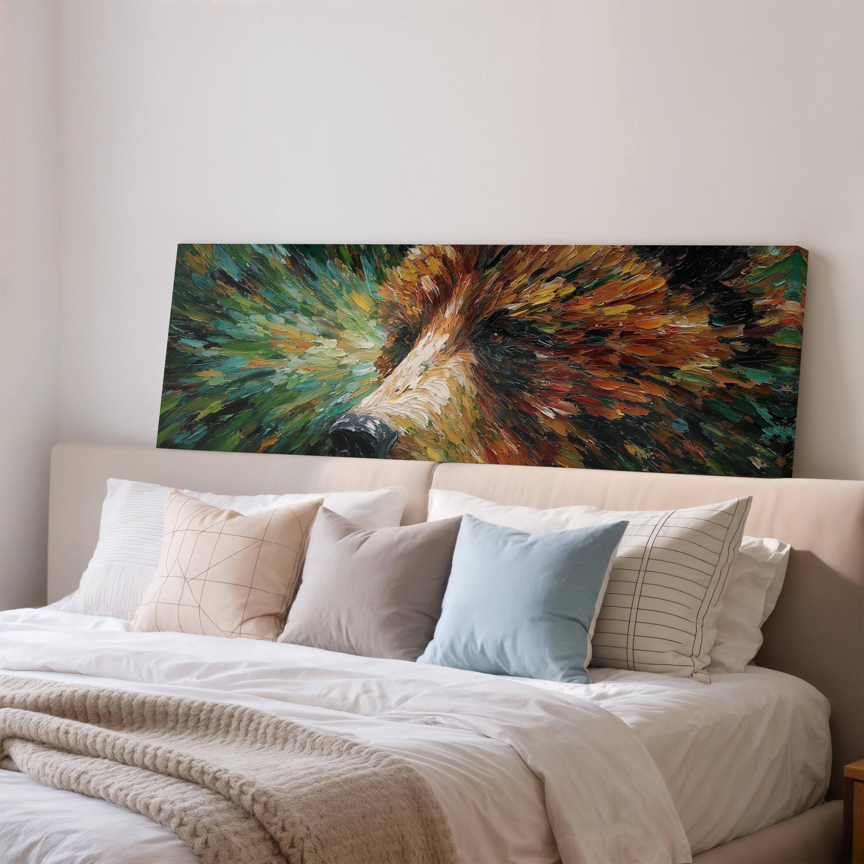 a large painting of a bear's face hanging on a wall above a bed with white bedding and various pillows.