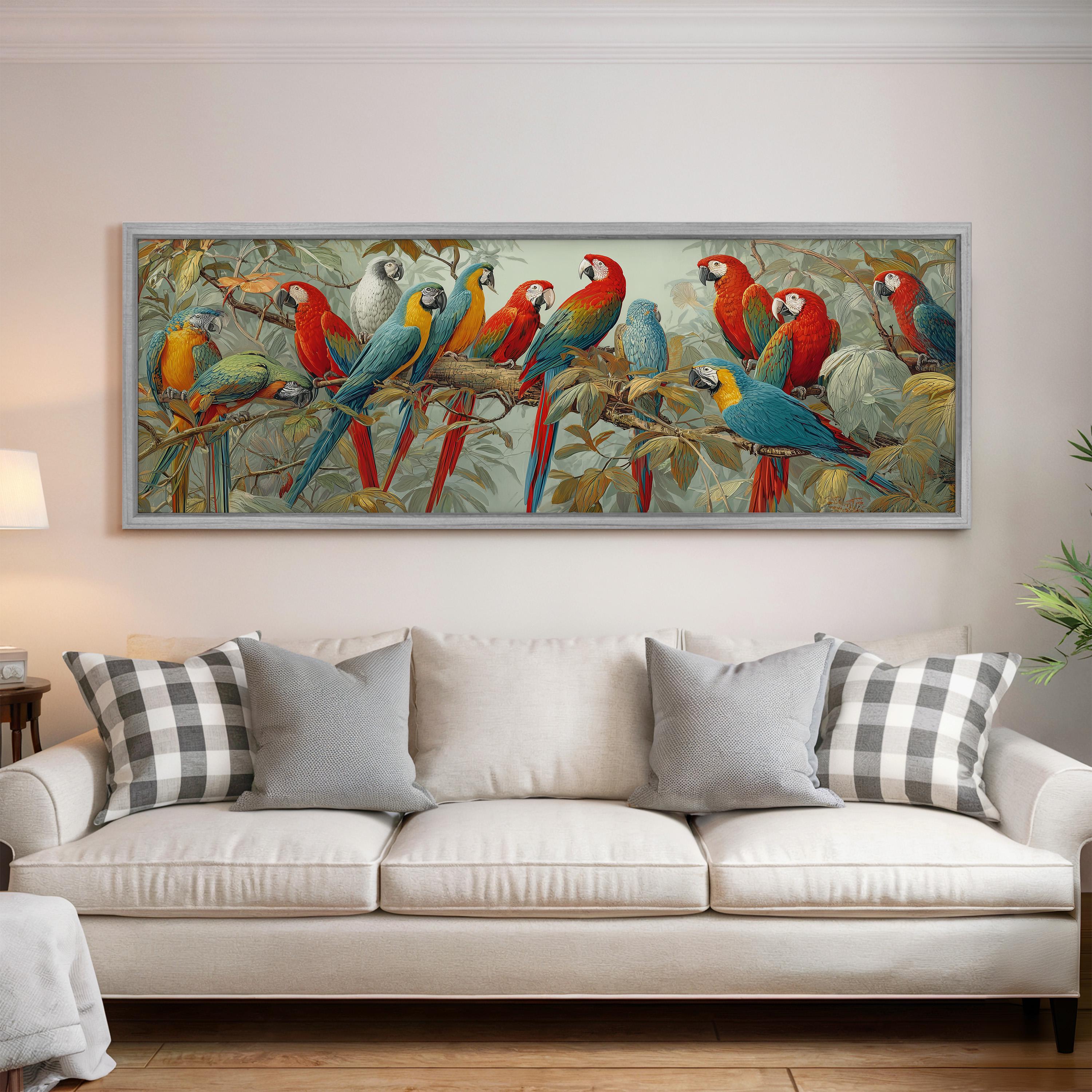 a large painting of colorful parrots perched on branches, hanging on a wall above a white couch with gray and white plaid throw pillows.
