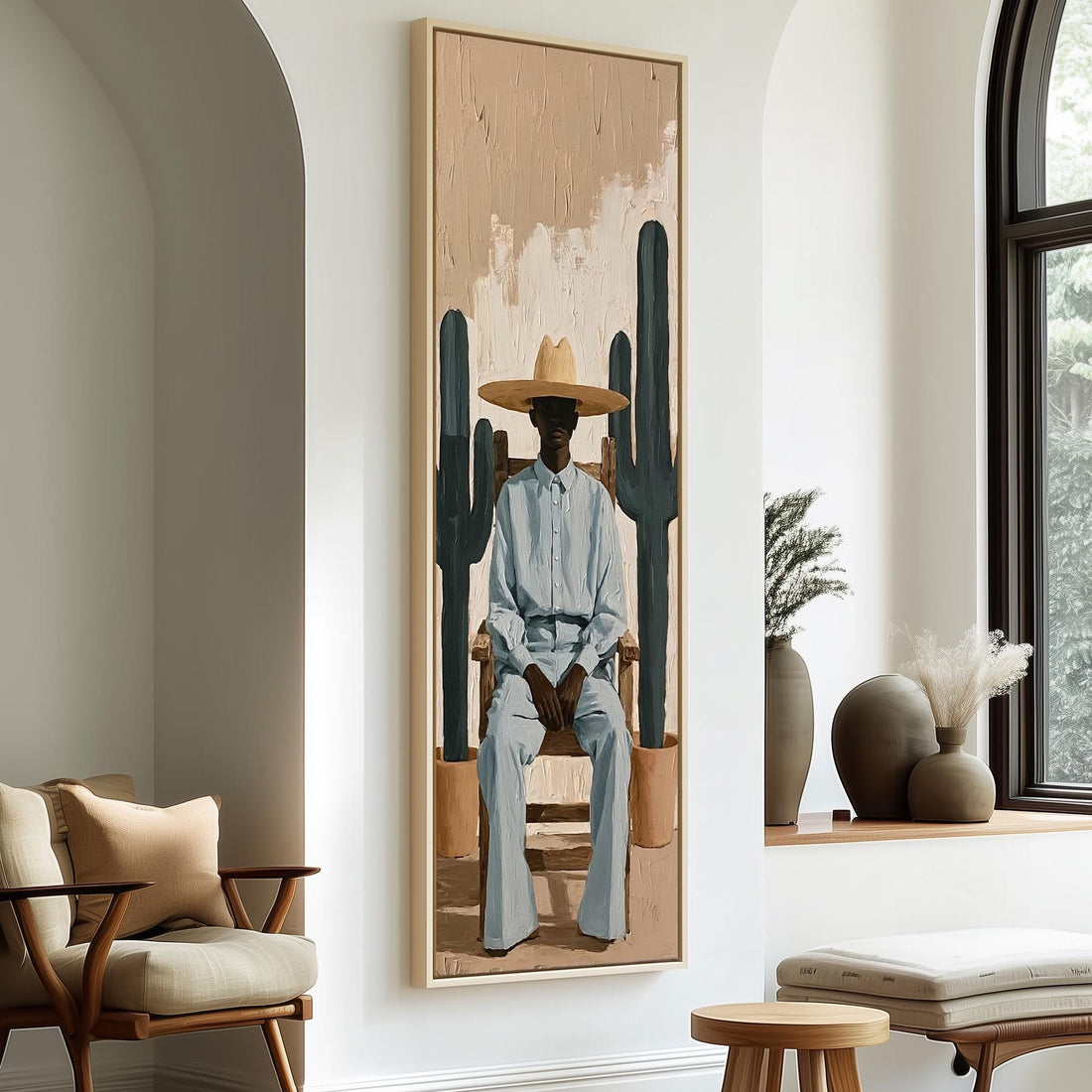 Cowboy seated between two cacti long vertical canvas print in a sunlit living space