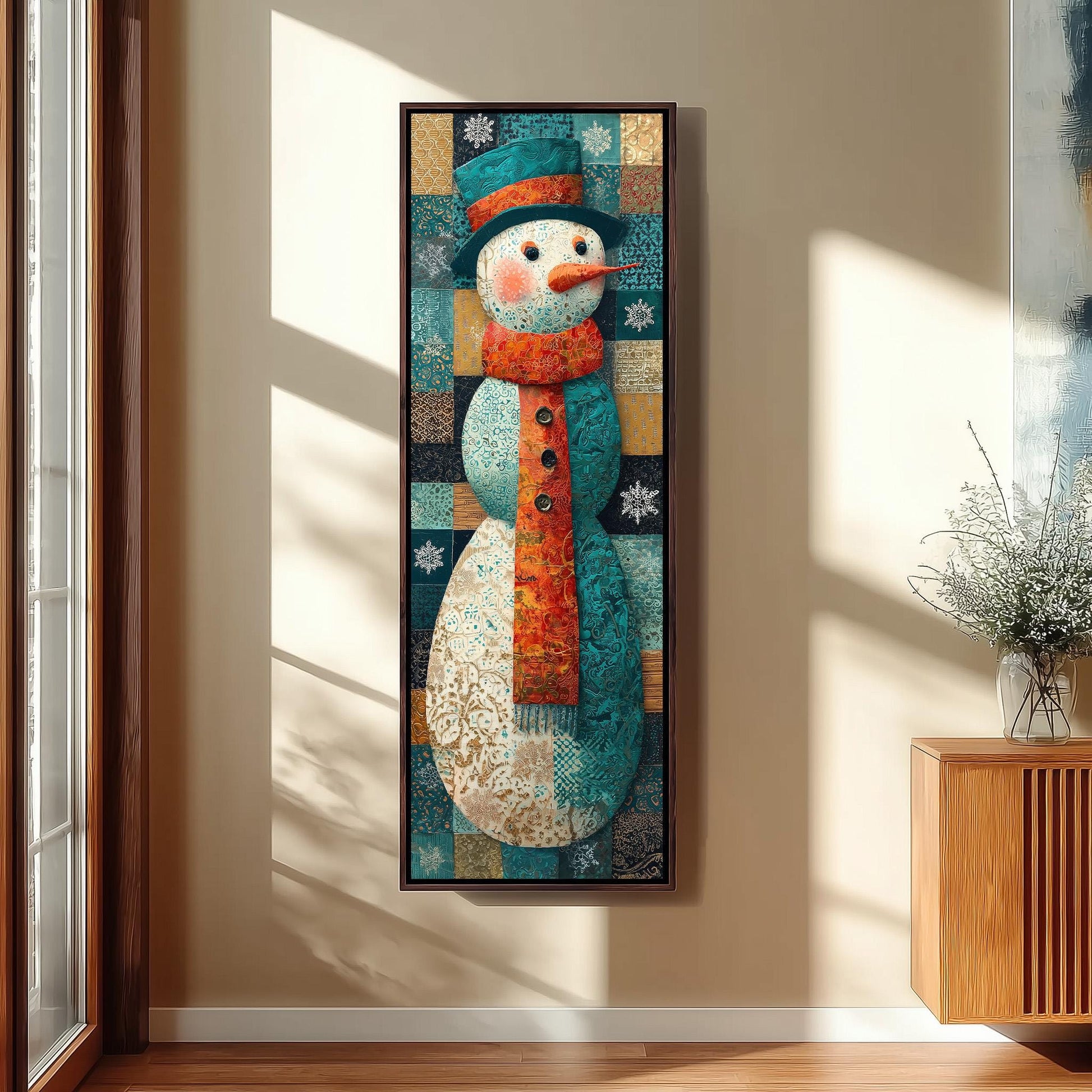 A large, colorful painting of a snowman is hanging on a wall in a room with a wooden cabinet and a vase of flowers.